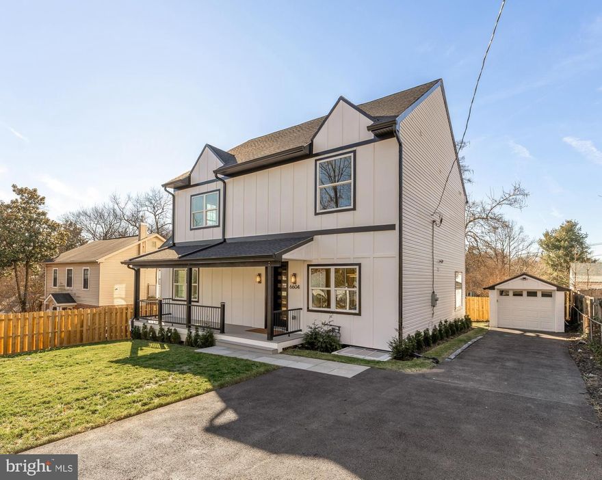 This large, newly renovated detached home offers 10+ foot ceilings on the main and upper levels and hardwood floors throughout. Main level includes a foyer, sitting room or office, open living and dining area with fireplace, and sliding glass doors to the rear patio. Kitchen features custom cabinetry, quartz countertops, KitchenAid appliances, a five-burner gas range, walk-in pantry, and large island. Main-level bedroom with walk-in closet and full bath.
Upper level includes a primary suite with fireplace, walk-in closet, and ensuite bath with soaking tub and double vanity. Two additional bedrooms share a Jack-and-Jill bath. Washer and dryer on upper level.
Lower level offers a recreation room with wet bar and wine and beverage cooler, fifth bedroom, full bath, and walk-out access to the backyard. Fully fenced yard with patio and detached garage. Located in Takoma Park, walkable to parks and schools, minutes to Metro, and close to weekend farmers market.