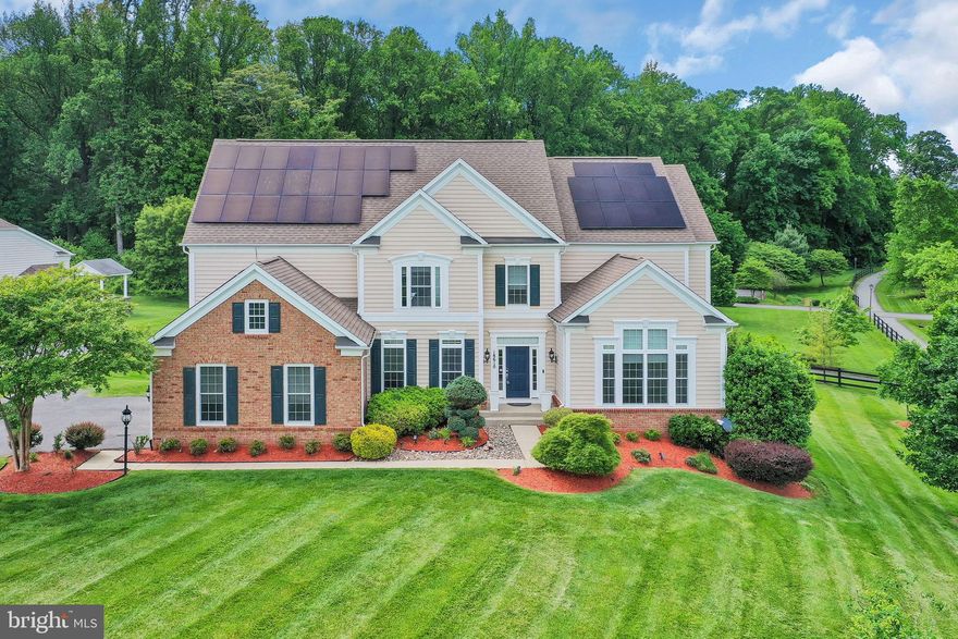 Arguably the premier lot and largest floorplan in the esteemed Reserve at Fair Hill! Solar panels fully paid off! This magnificent Colonial spans over 8300 square feet of finished space, boasting 6 bedrooms and 5.5  baths, situated on a sprawling 35,000 sq ft lot nestled in a serene cul-de-sac overlooking the tranquil North Branch of Rock Creek in Olney. This exceptional homesite provides the ideal backdrop for unforgettable gatherings, bordered by acres of picturesque wooded Rock Creek parkland. Meticulously maintained and ready for immediate occupancy, it features a breathtaking eat-in kitchen equipped with stainless steel appliances, exquisite granite countertops, and an abundance of custom built-ins, including a convenient workspace, all complemented by striking floor-to-ceiling windows. Convenience meets luxury with a first-floor primary suite complemented by a second primary suite on the upper level, along with three additional generously-sized bedrooms boasting spacious walk-in closets. Noteworthy highlights include a substantial main floor office, a captivating 2-story great room showcasing an impressive elevated gas fireplace and Palladian windows. Gleaming wood floors, a gourmet kitchen, top-quality blinds, and an outdoor oasis featuring an expansive Trex deck and flagstone patio elevate the allure of this home. The three-car sideload garage and driveway provide ample parking. The lower level presents an entertainer's dream with a sizable and impressive recreation room featuring an elegant upscale built-in bar, billiards area, potential theater/game room, and a spacious bedroom with a sizable walk-in closet and attached full bath. Ample storage space offers versatility, doubling as a home gym.
Experience unparalleled living in this meticulously crafted residence offering a perfect blend of elegance, comfort, and convenience. Located just moments from commuter routes such as ICC-200, downtown Olney with its variety of groceries, restaurants, and shops, as well as recreational attractions including the Manor at Silo Falls, Blue Mash Golf Course, OBGC Community Park, and Lone Oak Farm Brewery.