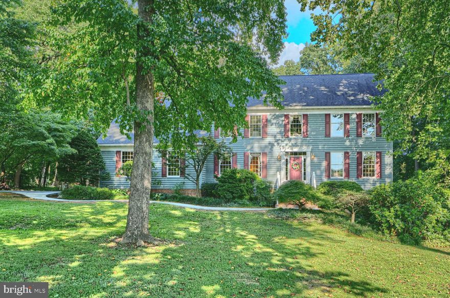 Welcome to this Classic traditional, custom-built home, approximately a mile from Jacksonville/Four Corners. It is a true 5 bedroom home with a full finished basement, hardwood floors, perfect for the Holidays, entertaining,  and working from home. The wide welcoming foyer leads to a first-floor office with French doors and front-facing windows. Natural light floods the living and dining rooms. Crown moldings enhance both the very generously sized rooms. Anderson windows allow plenty of light throughout.
The kitchen is the heart of the home with granite countertops, hardwood cabinetry, stainless appliances, a coffee bar/ buffet area, and an island with stool seating. There is also a walk-in pantry, plenty of table space, access to the deck, and the mudroom area to the garage.  The inviting family room is anchored by a brick fireplace with a wood- burning stove insert, plantation shutters on the windows and a slider to the rear deck.
The finished walk-out lower level is great for playing, watching TV and playing pool. There is a rough- in for an additional bathroom and a massive storage room  The deck and pool area are perfect to make this an at home resort. Updates include Roof 2016, HVAC 2020, Hot water heater, Buck wood stove insert,