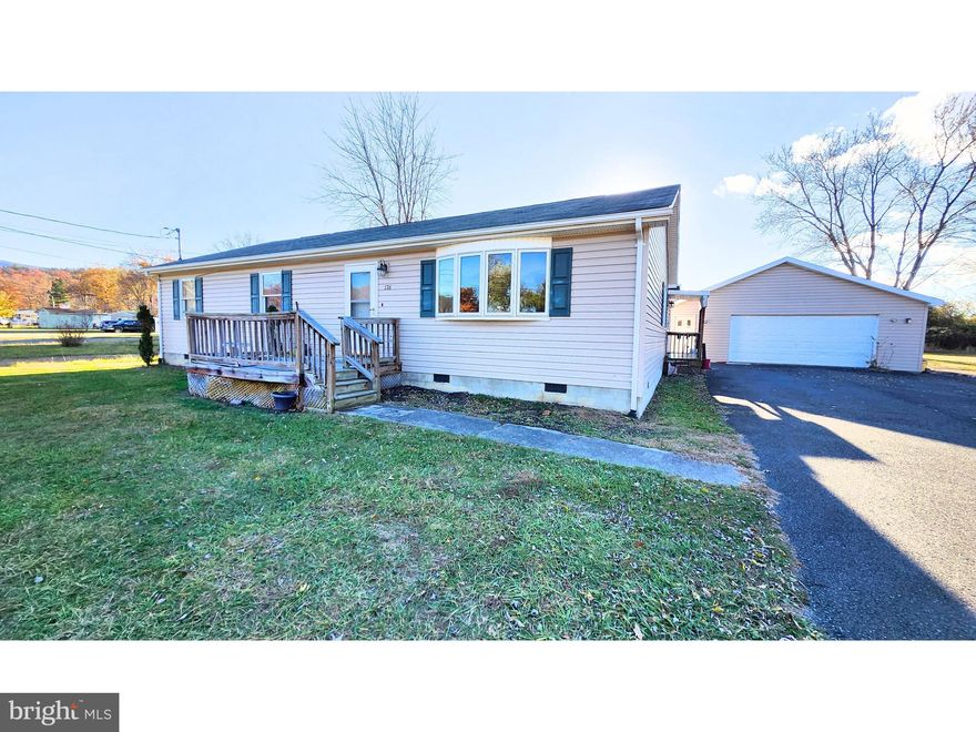 Step inside this well maintained 3-bedroom, 2.5-bath single-level ranch house with a classic layout that feels like home from the start. The spacious living room welcomes you with a large bay window that floods the space with warm, natural light. Whip up meals in the large eat in kitchen that’s perfect for a small dinner or a big gathering.  The incredible laundry room is complete with two huge closet/pantry spaces, a convenient half bath, and bonus storage!  Down the hall is a full bathroom, 2 generous size secondary bedrooms and a primary bedroom with a full bath and large walk in closet.
All situated on just over a  half acre nice level lot - expansive yard space for play, gardening, or relaxing—plus not one but two oversized detached garages with front-entry doors, ready to fuel your passions. Whether you're a car enthusiast, mechanic, crafter, or hobbyist, these massive garage spaces offer endless possibilities!   Blacktop driveway provides additional easy maintenance parking!  
Craving small-town charm in a peaceful rural setting? This is it! Just minutes from shopping, churches, schools, and endless outdoor adventures. And the best part? The seller is already replacing and repairing the deck and porch!