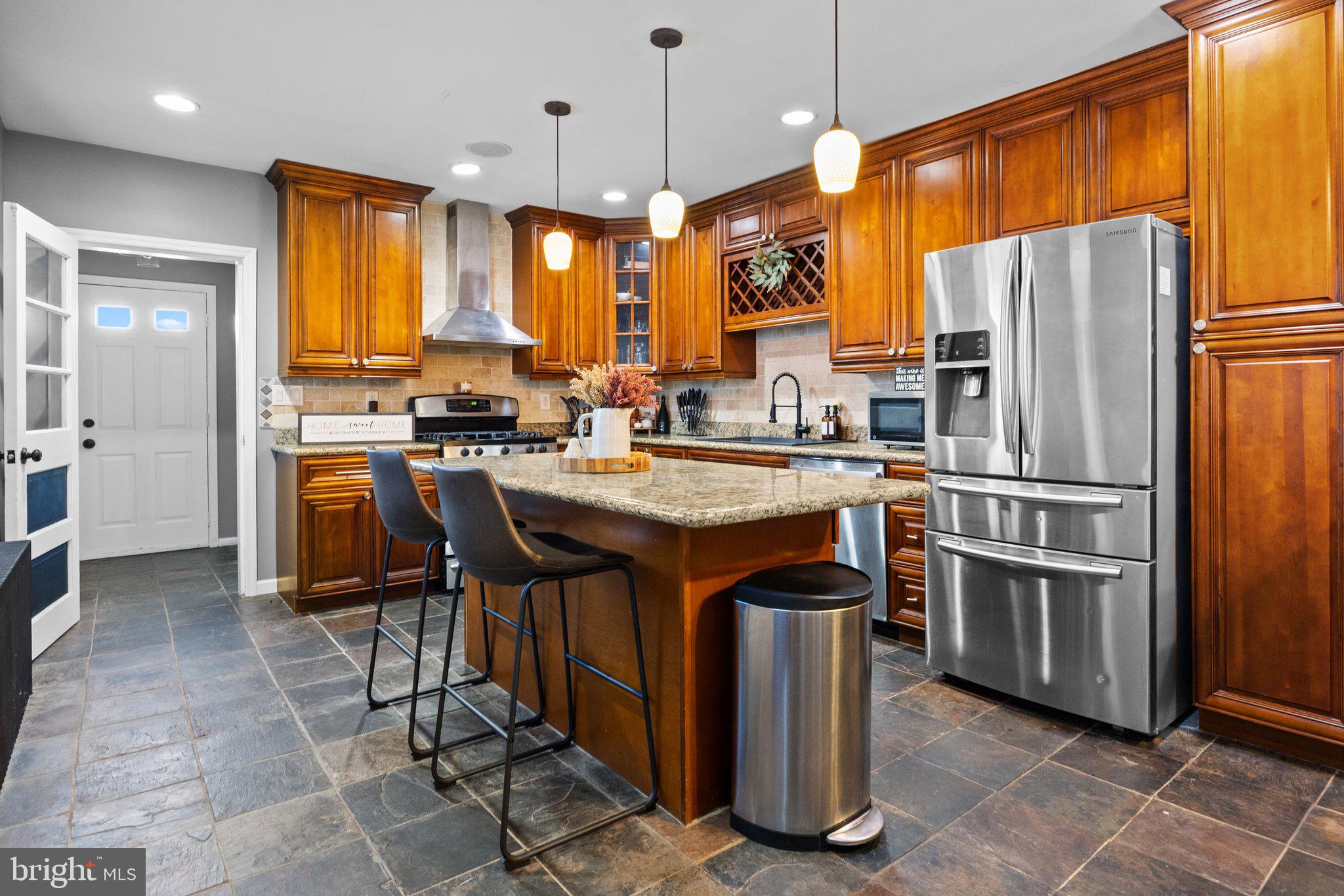 Welcome to 335 Penn Street. Spacious twin in the heart of the Boro! This 4 bed, 1.5 bath has been remolded from top to bottom. This massive kitchen is completed with stunning cherry cabinetry, granite counter tops, large center island, recessed lighting and stainless steel appliances. Brand new sewer line, and the roof, and furnace were both replaced by the previous owners within the last 10 years. Real hardwood floors throughout the first floor. Upstairs features 4 large bedrooms , one of which is nestled on the third floor.
