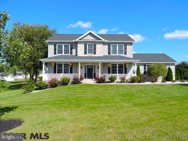 Forest Heights Beauty! This Dave Lingle built 2 story home has beautiful curb appeal featuring stone accents and a lovely front porch. Wonderful floor plan, neutral colors and HW floors throughout 1st floor. Open entry with formal living & dining room includes chair rail and crown molding details. The kitchen features granite countertops with large island, SS appliances and custom Amish built soft close cabinetry. Enjoy dining in the breakfast area with French doors to the covered deck and beautiful back yard. The family room features a propane fireplace and the home has built in surround sound. The second floor boasts a large master bedroom with en suite bathroom and walk in closet. 3 additional bedrooms, full bathroom and laundry room complete the 2nd floor. Basement has been radon mitigated, plumbed for a full bathroom and includes 2 egress windows allowing for additional finished space. Call to schedule your showing today. This one won't last!