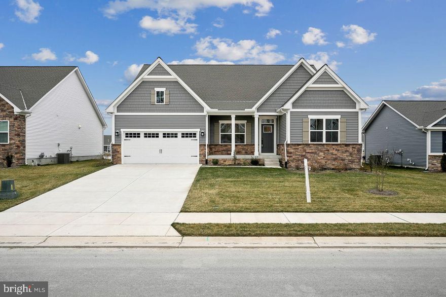 Welcome to 30435 Indigo Way, a beautifully crafted home built in 2024 offering over 3,000 square feet of finished living space with a spacious, well-designed layout and modern finishes throughout. A grand foyer welcomes entry, with a versatile flex room just off the front, ideal for a home office, playroom, or additional living space. On the opposite side of the foyer are two generously sized bedrooms with a full hall bathroom in between, featuring a tub and tiled surround, ideal for family or guests. The hallway opens into an impressive great room highlighted by vaulted ceilings and large windows that bring in an abundance of natural light. The open-concept layout flows seamlessly into the chef’s kitchen, complete with a large center island, quartz countertops, abundant cabinetry, wall oven, built-in microwave, and natural gas range. Just off the kitchen, the dining area offers a comfortable space for everyday meals and entertaining, with scenic views adding to the ambiance. The primary suite is privately located and features vaulted ceilings, a spacious walk-in closet, and a well-appointed en suite bathroom with a double vanity and a beautifully tiled walk-in shower. A private door from the suite leads to the covered porch, creating a peaceful outdoor retreat overlooking the pond. The finished basement provides flexible living space ideal for a recreation room, home gym, media room, or guest area. Outside, a large concrete driveway and an attached two-car garage provide convenience and functionality. With thoughtful design, generous living spaces, and scenic pond views as a bonus, this home offers comfort, style, and versatility in a like-new setting.