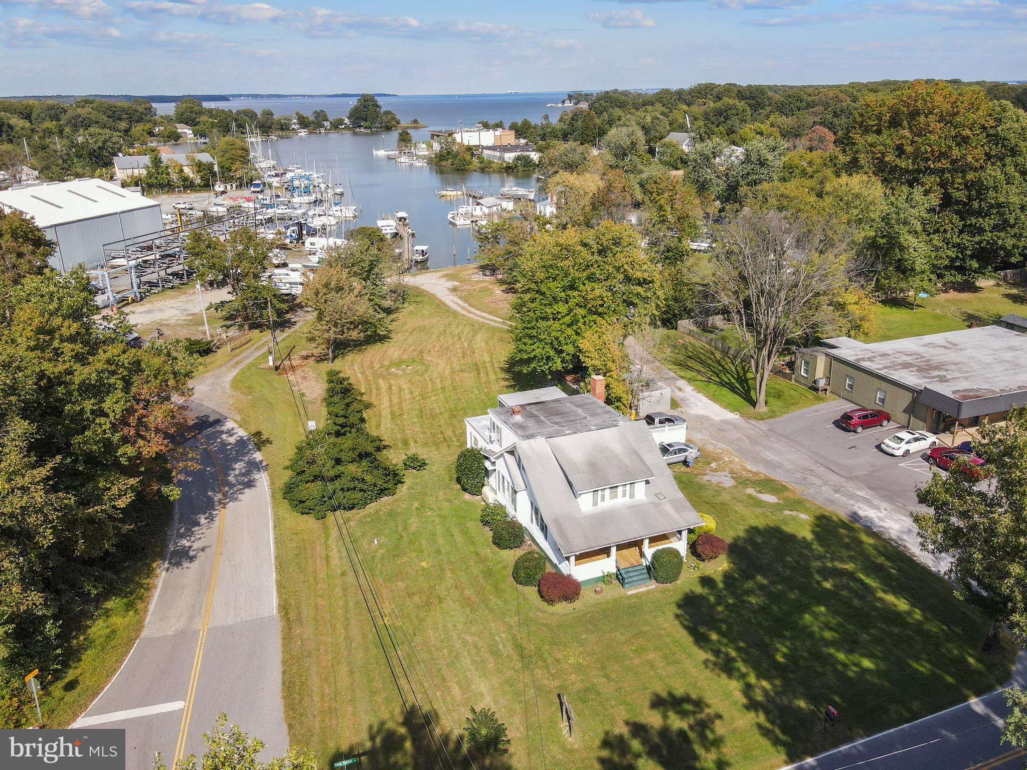 4 beds/ 1 full bath and 1/2 bath with shower.2144 SQ FT. Home and income opportunity goes with this four bedroom home on .57 acres of (C1B) commercial zoned property. Additional .375 acres and .1243 acres of (MA2) marine zoned property, totaling 1.0693 acres, with 135 feet of bulk headed waterfront, 200 foot pier, and 12 boat slips. Water depth from 4 to 8feet, that can accommodate boats in excess of 40 feet. Total income from 7 of the 12 slips in 2021 was $11,300. POTENTIAL $20,000 PLUS RENTAL INCOME IN ADDITION TO DRY STORAGE AVAILABLE. Many upgrades and extras. Information sheet in the document section of the listing or may be emailed to interested parties. Cold box has been removed.