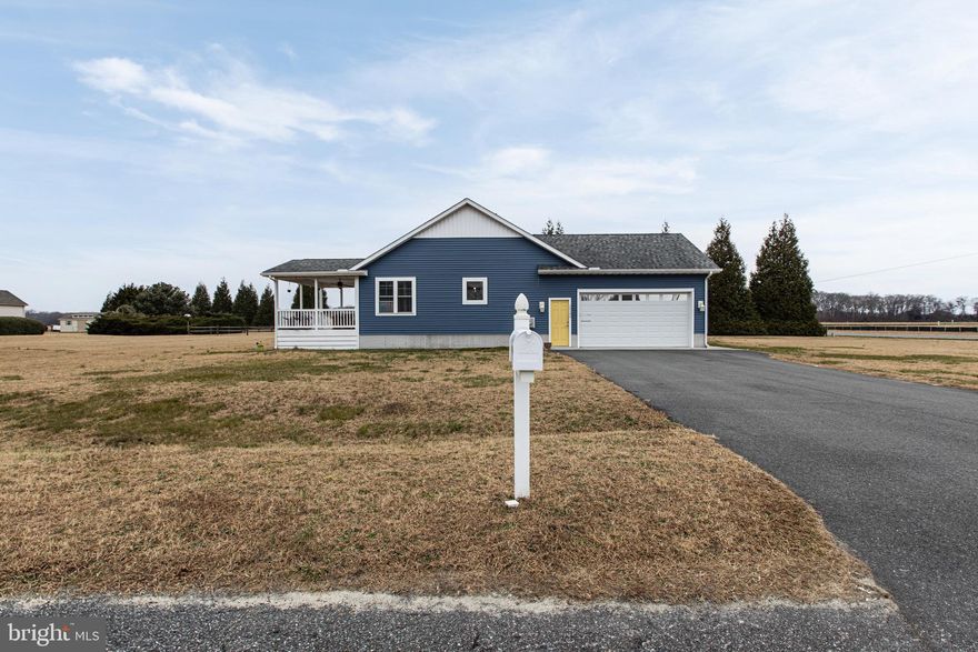 Experience the perfect blend of coastal proximity and modern comfort in this stunning 2019-built rancher, located just 30 minutes from the sun and sand of Bethany Beach. This home lives large with a bright, airy open-concept heart where the kitchen, dining area, and living room flow seamlessly together, perfect for hosting weekend getaways or enjoying quiet evenings under the vaulted ceilings. The split-bedroom floorplan offers a private primary suite with a generous walk-in closet, while two additional bedrooms provide plenty of space for family, guests, or a dedicated home office. Outside, you can soak in the expansive Delaware views from your charming covered porch or head out from the attached two-car garage to explore the nearby coast. Offering the ease of relatively new construction and a layout designed for modern life, this is an incredible opportunity to grab your slice of the beach life without the boardwalk price tag.