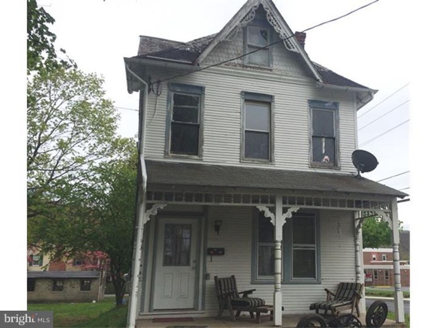 Calling all investors!  Looking for your next project?  Here it is! Unique Antietam property with tons of potential.  Generous room sizes, charming details and 12 garages... you can live the house and pay the mortgage with the garage rentals! Property being sold as-is, buyer is responsible for any municipal inspections/repairs as required. All garages but one are rented and home is currently rented too at $1270/month.  Tenant will stay if you like!  This home has the potential to shine once again, call today for your personal tour!