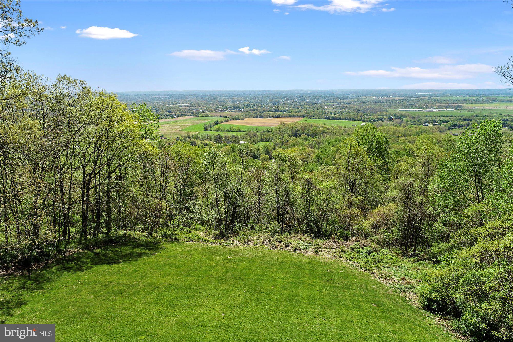 A great home starts with a great lot!!! A million dollar view starts with the southernly view from--Sky Top Trail. Grab your Builder and Architect and come to Sky Top Trail to see what you can make happen on one of the last remaining lots on Sky Top Trail with southern exposure. Lot has been Perc Approved for a Standard Septic System. Deed restrictions and an Open Space Easement do apply. Have your Realtor review them with you in Associated Documents. The lot is open to any Builder. If your ready to go green this is your place to build your dream home.