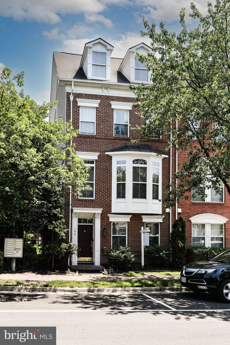 Presenting a RARELY available, upgraded END-UNIT "BRADLEY" model in Cameron Station!

The owner has invested significantly in upgrading this gem! Highlights include:
* New HVAC systems (2024 and 2020)
* Three updated bathrooms featuring quartz countertops, new faucets, new light fixtures, and a brand-new floor in the primary bathroom (2025)
* New luxury vinyl plank flooring on the main and second levels (2024)
* Custom epoxy garage floor and fresh paint (2025)
* Fresh interior paint in modern neutral tones and a freshly painted exterior (2024)
* New door modern door handles throughout
* Trex deck (2022)
* Gorgeous Italian marble in the foyer

The main living level boasts extra windows and glass doors that flood the space with natural light. The rear deck and cozy fireplace in the great room are visible from the open-concept dining room and kitchen. A spacious eat-in breakfast area, bar-style island, and wine-lover’s dream bar with a built-in wine cooler create maximum flow and livability on this level.
The open foyer offers a welcoming entrance with stylish modern upgrades, access to the luxury garage, and a versatile space ideal for an office, sitting area, workout room, or playroom.
Upstairs, the bedroom level features an oversized laundry closet for added convenience, two full bathrooms, and two large bedrooms—including a Primary Suite that will take your breath away. Enjoy a large walk-in closet, vaulted ceilings, bonus space, oversized windows, and a beautifully selected chandelier.
A private fourth-level suite provides bonus space perfect for an au pair, in-laws, guests, or could serve as a workout room or artist’s studio.

Modern amenities, recent upgrades, a convenient location, access to parks and trails, tasteful design, a free shuttle to the Metro, a 2-minute walk to the Pentagon bus stop (12-minute ride), and extra parking make this spacious end-unit a rare opportunity this summer.

** Open house, Saturday, 28 Jun 2025, 1-3 PM