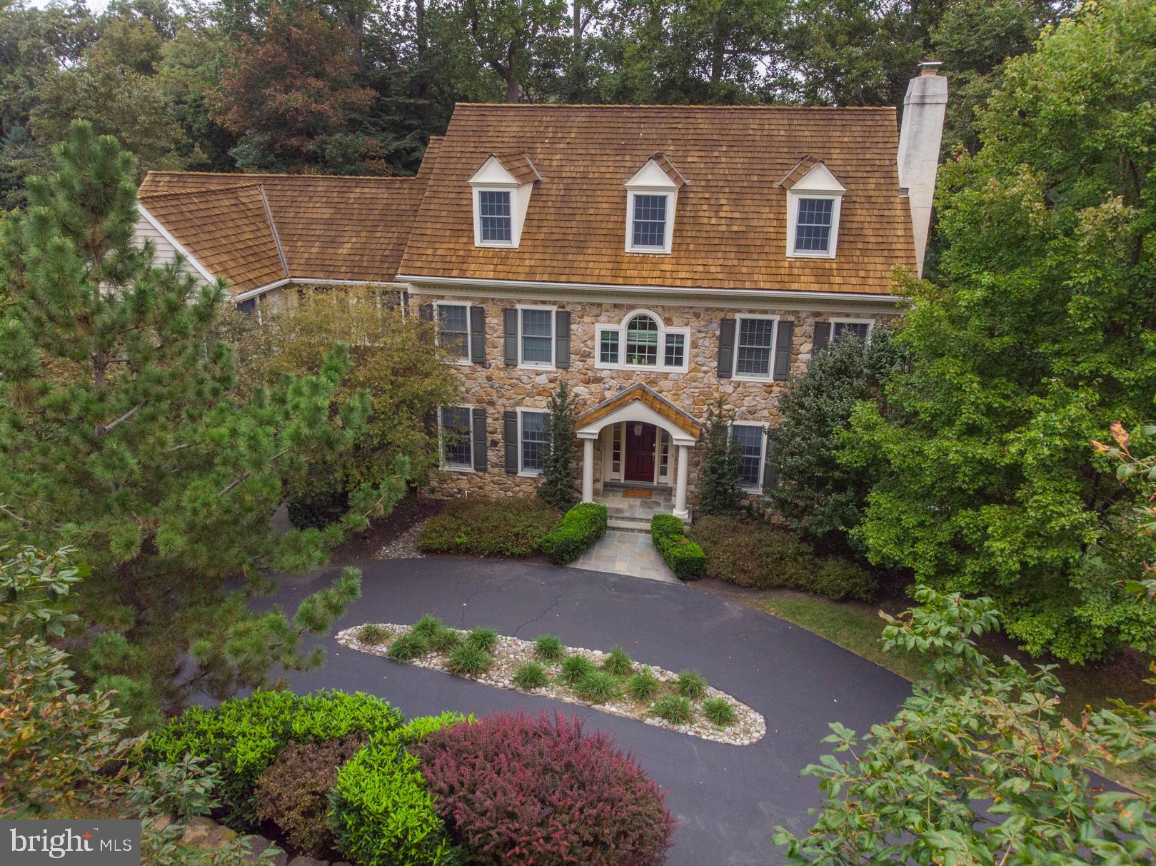 Tucked away on a quiet street in coveted Harrison Estates, you’ll find this gorgeous 5 Bedroom, 3 full 3 half Bathroom Colonial Home. Situated on 1.38 manicured acres and over 6,500 interior sq/ft, this home has every modern amenity complete with old world charm. Grand front to back Center Hall with curved archways, crown molding, recessed light and French door reveals its modest elegance as you enter into the home. Entertain in the formal Living Room with marble surround gas fireplace, or the spacious formal Dining Room with crown molding and recessed lighting. The center island Chef’s Kitchen is filled with every convenience for the modern day cook, including custom Kountry Kraft cabinetry, granite counter tops, built-in shelving, Subzero, Wolf 6-burner+griddle cook top, double oven, warming drawer, pantry, butler’s pantry with prep sink and so much more. The Kitchen opens into the sunlit Breakfast Room with 2 walls of windows and French door to deck. Relax in the striking Family Room that boasts vaulted ceiling, fireplace with stone surround, built-in shelving, ceiling fan and recessed lighting. Spacious Office, Two Powder Rooms, family entry area with mudroom on the way to 3 car garage and backstairs to 2nd floor complete the main level. On the 2nd Floor, enter into the beautiful Main Bedroom Suite featuring tray ceiling, two walk-in closets, ceiling fan, recessed lighting and separate Sitting Room. The luxurious Main Bath has water closet, oversized frameless glass marbled shower, 2 separate vanities, and jetted tub with marble surround. There are 4 spacious additional Bedrooms, one with en-suite bath, two with jack&jill bath, all with good-sized closet space and ceiling fans. The Laundry Room has shelving and utility sink and is conveniently located on the 2nd floor as well. The very large walk-out finished carpeted lower level with Powder Room offers complete versatility. Whole House Generator, New Heater, Brand New Carpeting on 2nd Floor. Once you tour this fantastic home, you won’t want to leave! Conveniently located near the towns of Newtown Square and Wayne. Marple Newtown School District and close to Episcopal Academy.
