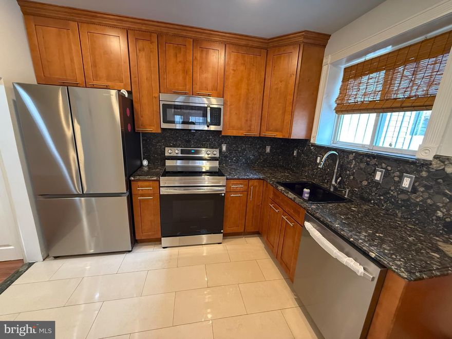 **Location, location, location!** Walk to **Homegrown** or **Starbucks** for your morning coffee and enjoy living just off Broad Street in the desirable **Melrose** neighborhood, perfectly situated between **East Passyunk** and the stadiums.
This renovated and inviting home features **high ceilings**, **central air**, **crown molding**, **recessed lighting**, **new first‑floor flooring**, **original pine floors upstairs**, **updated plumbing, sewer, and gas lines**, a **new roof (2026)**, an **updated brick front with side stoop**, and **large windows** that fill the home with natural light.
The open living and dining area offers a seamless layout ideal for everyday living and entertaining. The kitchen includes **river rock granite countertops**, a **full granite backsplash**, **solid wood oversized soft‑close shaker cabinets**, **travertine tile flooring**, **brand‑new Samsung stainless steel appliances**, and space for an eat‑in table.
Upstairs, you’ll find **three nicely sized bedrooms** with closets and a **full retro‑style bath**.
The **finished basement** provides flexible living space with a **full bathroom featuring a walk‑in shower**—perfect for guests, a roommate setup, home office, or recreation area. A generous laundry room includes a utility sink and houses the home’s mechanicals: **tankless water heater**, **200‑amp electrical panel**, **Speed Queen washer and dryer**, and **Carrier HVAC system**.
Enjoy a **large, sunny, private backyard**—ideal for relaxing or entertaining.
Convenient to the **Broad Street Line**, **East Passyunk restaurants**, nightlife, shopping, and all major highways. **Easy to show!**
PS: more pics and 3d walkthrough will be available friday.