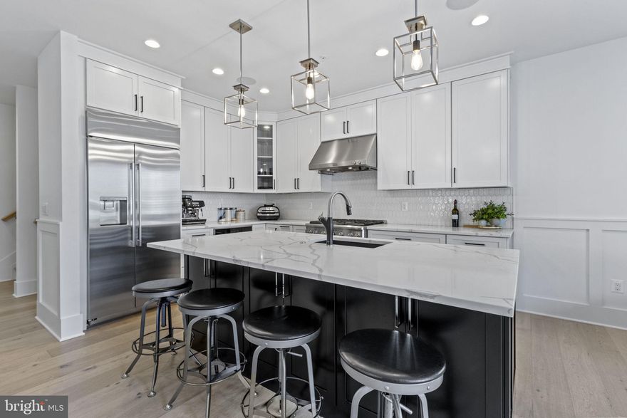 Introducing a truly remarkable custom-designed home in a prime location, crafted with impeccable quality and attention to detail. This stunning Arts & Crafts residence, built by Mona Design Build, is nestled in the highly sought-after Eastport neighborhood, just steps away from the picturesque Spa Creek.

Elegance and sophistication define this almost-new construction, boasting approximately 2,800 square feet above ground with a RARE 2-car garage. Step inside and be greeted by an open floor plan, accentuated by soaring ceilings, abundant natural light streaming through large windows, and an array of exquisite architectural details. The high-end finishes, including gorgeous white oak hardwood floors, extensive wainscoting, shiplap accents, and recessed lighting, create a luxurious ambiance throughout.

Prepare to entertain in style in the gourmet kitchen, featuring a generous quartz island, sleek quartz countertops, a stylish glass tile backsplash, and top-of-the-line stainless-steel appliances. The heart of the home is adorned with a cozy gas fireplace, perfectly positioned with a TV above for ultimate comfort and relaxation.

The upper level of this exceptional home encompasses four bedrooms, three baths, a convenient laundry area, and a well-appointed office space. Each bedroom offers a bright and spacious retreat, inviting relaxation and tranquility. The primary suite is a true haven, boasting a large walk-in closet, a cathedral ceiling, and a luxurious full bathroom complete with a freestanding soaking tub and a spacious walk-in Roman shower. The bathrooms throughout the home feature beautiful ceramic tile and sleek stainless fixtures, elevating the level of refinement.

Indulge in the added conveniences and peace of mind provided by the alarm system, natural gas on-demand hot water heater, and interior fire sprinkler system. The architectural 30-year asphalt roof shingles and durable hardi plank siding ensure longevity and minimal maintenance. Step outside to enjoy the front porch or retreat to the serene rear patio, where you can savor the peaceful breeze emanating from Spa Creek.

This exceptional property offers a full basement, providing ample storage space for all your needs. Convenient off-street parking is available, with a flagstone walkway leading to the side-loading detached two-car garage, adding both functionality and charm. Its so nice to have so much storage!

Embrace the coveted Eastport lifestyle, with close proximity to the popular bakery, a plethora of exceptional restaurants, prestigious yacht clubs, and the vibrant downtown Annapolis scene. Revel in the effortless balance between tranquility and convenience that this location offers.

Don't miss this rare opportunity to own a custom-designed masterpiece in Eastport. Schedule a viewing today and prepare to be captivated by the sheer elegance and sophistication that awaits you!