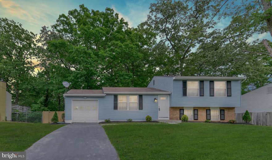 BEAUTIFULLY RENOVATED HOME WITH ATTACHED CAR GARAGE! Gourmet kitchen w/ granite counters, stainless appliances, white shake cabinets, back splash. New carpet, floor, recessed lights and fresh paint. Finished basement w/ Rec room and full bath. Huge fenced back yard. Conveniently located close to everything.