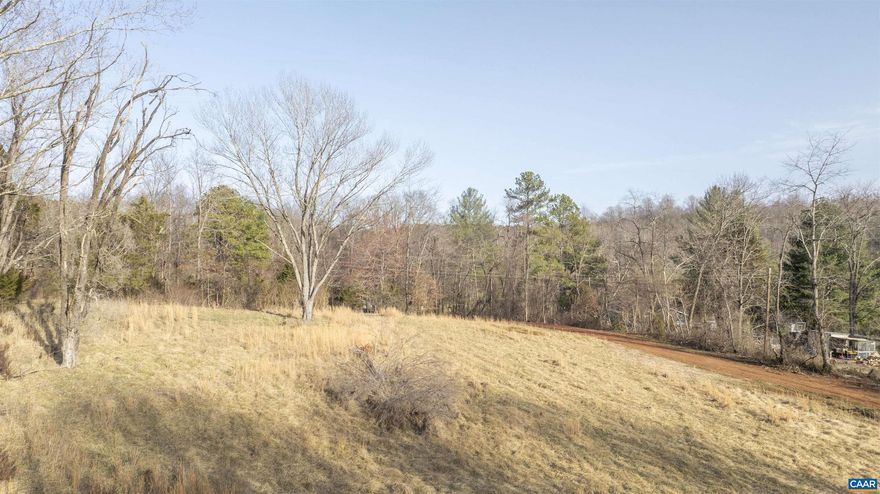 Rare opportunity to build your dream home in the heart of Ivy! This open, 2 acre parcel sits just off Morgantown Rd and a short walk from Murray Elementary school. The mostly open parcel does feature mature trees and open space, ideal for outdoor entertaining or garden space. The shared driveway has been roughed in and the lot is ready for you to start building!