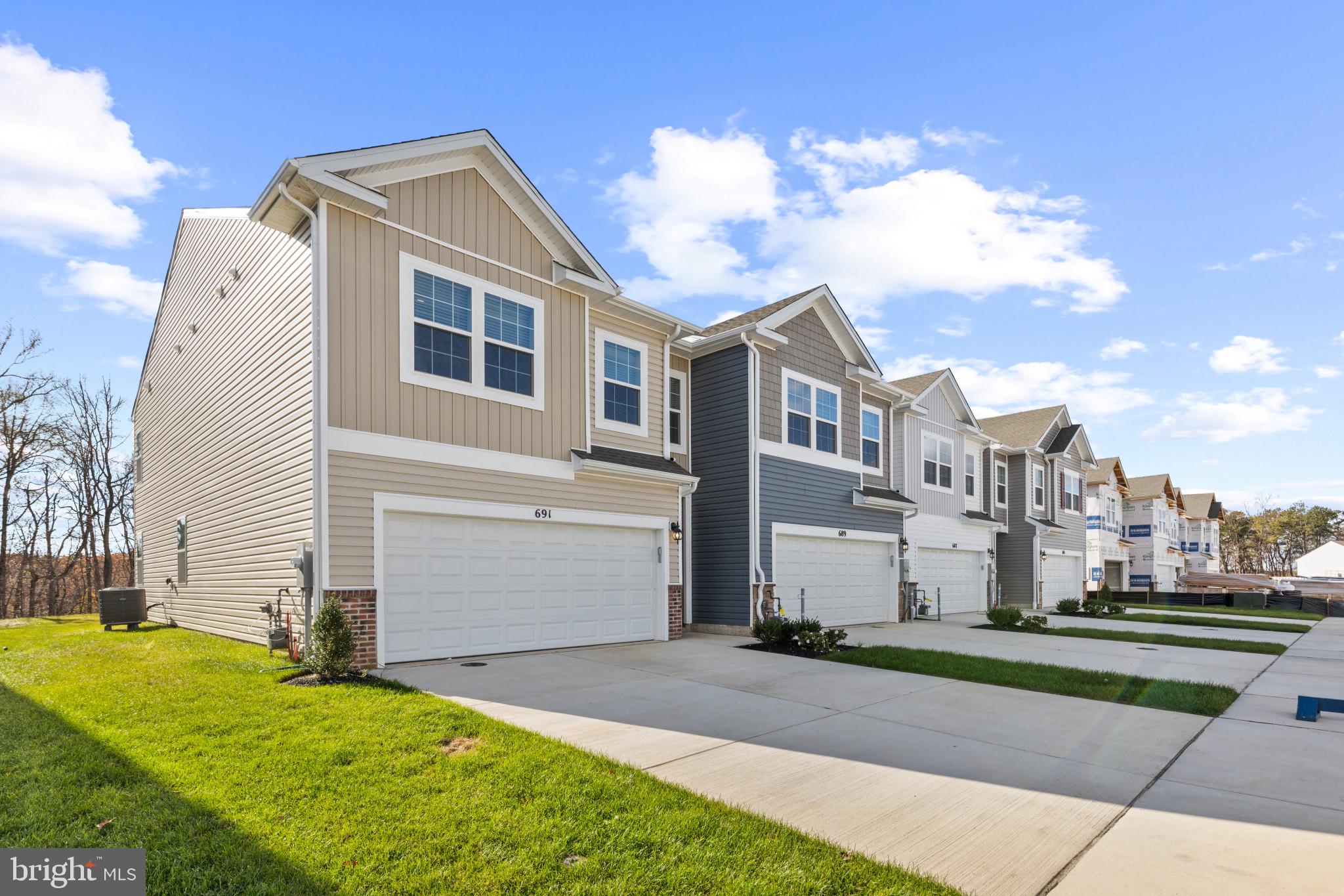 4 Bedroom, 2 car garage “Villa” style townhome!
IMMEDIATE MOVE IN!!
Welcome home to the Andrews two story, four bedroom townhome floor plan by D.R.Horton. The Andrews is an amazing 24 foot wide attached home that lives like a single family. The home sits at 1,934 square feet and has a modern design with a gourmet kitchen and an open floor plan with a sunny great room and dining area! You enter the home from a private walk-up porch to the front door. The home leads to an inviting foyer that flows seamlessly to a sophisticated, modern space. The 2-car garage is adjacent to the kitchen and makes unpacking your groceries a cinch. The kitchen has a 7+foot granite gourmet center island, perfect for food preparation, added seating, and entertaining. In addition to the beautiful cabinets, there is also a large pantry, stainless steel appliances and gas cooking! It’s a chef’s dream. Ascending to the upper level, you’ll appreciate the wide stairway and loft area. On the bedroom level, you’ll find spacious bedrooms with roomy closets, a well-organized linen closet, a thoughtfully upgraded full hall bathroom with a private area for bath and toilet. The upstairs laundry room is an added luxury making life easier and more efficient! The King-Sized primary bedroom is the perfect retreat, complete with a large, double-vanity bathroom and HUGE walk-in closet. The 3 secondary bedrooms are just down the hall and encircle the full hall bath. DR Horton is currently including our popular Smart Home Technology package, all kitchen appliances, blinds in the windows, ceiling fan rough ins, TV prewires, LED lighting and hard surface throughout the entire main level!
The Andrews floor plan is in the Ridgely’s Reserve neighborhood which is Harford County’s most sought after premier single family and “villa style” townhome community. Ridgley’s Reserve sits high over Harford County and provides breathtaking views of the tree lined community. Once inside the spacious, airy, greenery filled neighborhood its immediately evident that the developer put a lot of thought into the details. The Brick monuments and beautiful landscaping upon entry, large lots, playground, widened streets, pocket parks, walking trails, extra parking and more all come together to provide the community members a quiet, comfortable place to call home.
Ridgely’s Reserve is the first exit into Harford County! Conveniently located off I-95 at the Fallston – Joppa exit. This ideal location makes the commute quick and easy to just about anywhere! Including Aberdeen Proving Ground, downtown Bel Air, White Marsh, and north or south of Baltimore. Please come in for a visit!