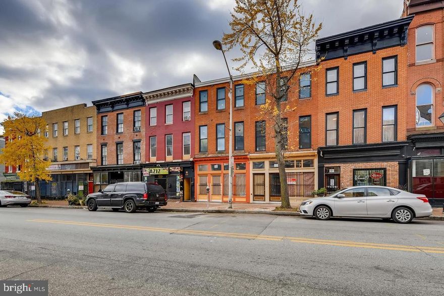 This turnkey mixed use building is ready for a new owner. (Photos are of the units before tenants.) 
Live in the vacant 2nd floor apartment or lease it out. The first floor commercial space and the 3rd floor apartment are both currently occupied.  Take advantage of off-street parking with a gated rear parking pad. It is a must see. Call for an exclusive showing.  Apartment One is a 2-bedroom/1 bath unit and the second apartment is an efficiency/studio that is currently renting for $900/mo.   Rental rates in the area for a 2/1 range between $1,200 - $1,300 a month.  Tenants pay all utilities except sewer.  Certified Lead Free by MDE. 
Ask you lender about possible FHA financing for his mixed-use property as the residential units total more than 51% of the total building square footage.