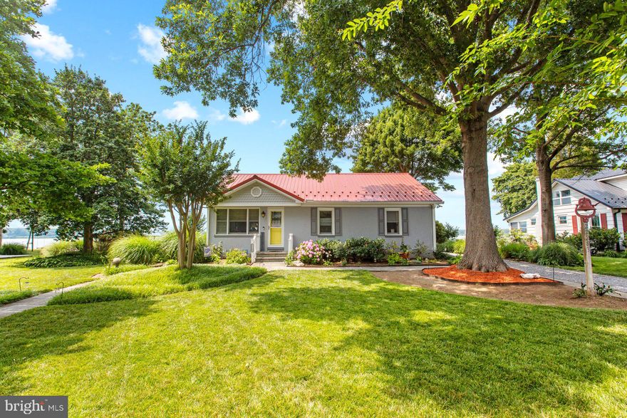 Million dollar sunsets and expansive views on St Clements Bay make this home an absolute must have!  The coziest rambler, nestled among the trees, gives way to a wide open floor plan and views of the bay as far as you can see from left to right. These sellers have been busy--- New roof and guttering,  new air handler for oil heat,  washer and dryer, refrigerator, stove and microwave, new granite countertops and backsplash, new maintenance free deck and fencing, grinder pump,  new main level bathroom,  beautiful new wide paned sliders overlooking the bay and new gas fireplace to help you get the picture.  Sellers also had a new french drain installed and re-finished most of the hardwood flooring. The basement is a perfect setup for hanging out or setting up your workout equipment, as these sellers have done. The inside of this summer-like retreat opens to magnificent outdoor living, similar to that of a magazine. A retractable awning  for the first deck adds shade at one level while canvas sails add  omniance for the lower deck.. You can't help but notice, the sellers take great pride in their yard, with beautiful flower beds, mature trees and well established new sod.  A 100'+ pier with 10,000lb boat lift offer the opportunity to slip out for an evening boat ride or an early morning chance to fish. Make the most of this beautiful opportunity to truly embrace all things wonderful in calling this waterfront retreat home!

Professional pictures will follow-