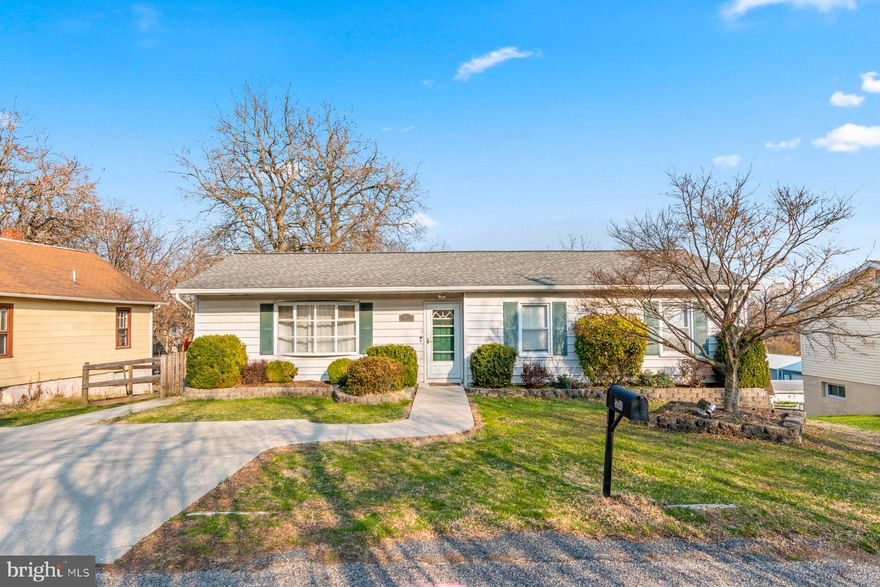 Pristinely maintained and move-in ready 3BR/2.5BA Rancher located on an extended lot in Parkville.  Pull into the triple-wide driveway, make your way to the front door and step inside a home filled with natural light, luxury flooring and carpet throughout, and a warmly painted color palette.  The main living space features a large living room, a dining area, and a kitchen.  The kitchen features wood cabinets finished with crown molding, including a pantry cabinet, stainless steel appliances, a stainless sink under a window, and a peninsula with seating for four that separates the living room from the kitchen. Down the hall are two sizable secondary bedrooms, a full bath, and a primary suite.  The primary offers a private bath featuring a walk-in shower. From the kitchen step outside onto a large wood deck that wraps around to overlook the amazing yard space.  The lower level features finished living space, including a large family room, a half bath, laundry, storage, and sliding doors leading to a patio in the split-railed, fenced yard.  The yard offers ample possibilities, including a shed and a large two-tier lot that could generate income or be used personally.  Imagine all this in close proximity to shopping, restaurants, and commuter routes.