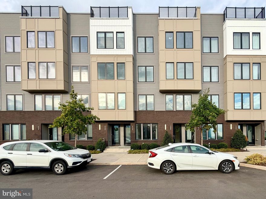 Welcome to 3100 Schirra Lane, Unit 120 — a rare riverfront residence offering direct, unobstructed Delaware River and bridge views. This 3-bedroom, 2.5-bath bi-level condo with a private attached garage is one of the few homes in Northbank positioned for true, front-row water views that cannot be duplicated. Built by award-winning Toll Brothers, this sun-filled home features floor-to-ceiling windows and a thoughtfully designed open-concept layout that brings the river into everyday living. Natural light, clean modern lines, and premium finishes create a space that feels both refined and comfortable, ideal for entertaining or quiet evenings overlooking the water. At the heart of the home is a chef-inspired kitchen with high-end appliances, sleek cabinetry, generous counter space, and built-in ceiling speakers designed for seamless daily living and hosting alike. Upstairs, the primary suite offers a private retreat complete with a spa-like ensuite bath, a custom walk-in closet by ClosetsByDesign, and a private balcony directly off the bedroom. Two additional well-proportioned bedrooms provide flexibility for guests, a home office, or long-term living needs. Additional highlights include in-unit washer and dryer, central heating and air, an attached garage, high-end finishes throughout, and the valuable benefit of Philadelphia’s remaining 9-Year Tax Abatement. Located in the vibrant Northbank waterfront community, residents enjoy immediate access to riverfront trails, green space, and a connected neighborhood lifestyle just minutes from Fishtown, Northern Liberties, and Center City, with easy access to I-95, public transportation, shopping, and dining. Homes with direct river and bridge views are exceptionally limited, and opportunities like this rarely come to market, making this a unique chance to secure a true waterfront lifestyle in one of Philadelphia’s most desirable and evolving communities.