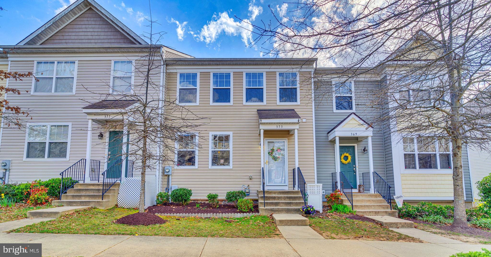 Come explore and fall in love with this three level townhouse, thoughtfully designed by the original owner with custom touches through out including extra square footage bump outs on all three levels making this model one of the largest in the community. Main level features an open floor plan with family room open to the beautifully upgraded kitchen and dining area plus half bath and access to rear deck creating the perfect layout for both everyday living and entertaining. The upper level delivers a luxurious primary suite with the extra added space allowing for a private spa like primary bathroom, walk in closet and cathedral ceilings. Two additional bedrooms and hall bath complete this level. Lower level offers a generous rec room with bar area, ample storage, laundry room, third full bath and a level walk out to a second outdoor living space ideal for gatherings or just enjoying some quiet time. Located in the heart of town, this home is conveniently close to shops, restaurants, medical facilities and so much more.