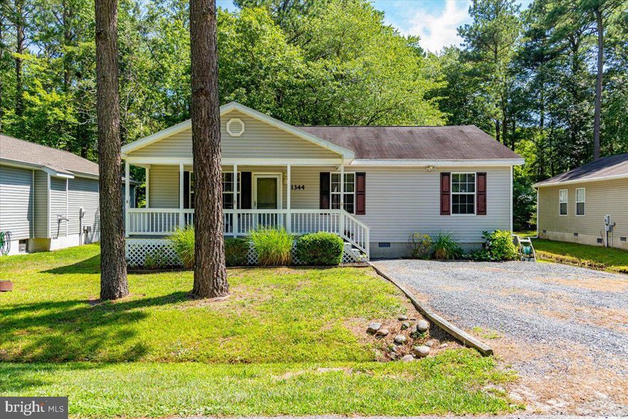 Nicely situated 3 bed 2 bath one story home is  across from a 27 acre  sanctuary.  This contemporary home offers a very functional, open and bright floorplan, a 6x22 covered front porch, a nice private screened porch, separate laundry room and an attached shed.  Freshly painted throughout!  Spacious kitchens boasts updated (approximately 3 year old) appliances with good size pantry and coretec flooring which flows throughout the living areas and is also about 3 years old.  HVAC was replaced in November of 2020.  Living room  has cathedral ceilings, a built in corner gas fireplace , skylight and ample windows making it nice and bright.  This must see home is ready for immediate occupancy.   Enjoy the many amenities of Ocean Pines, proximity to restaurants, shopping and Ocean City!!
