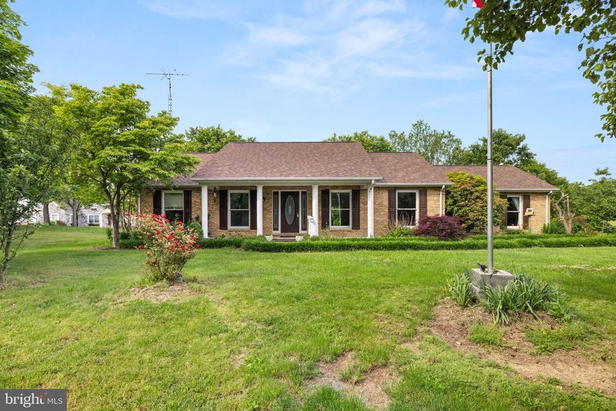 Contract Pending Release and priced under Appraised Value 
Charming All-Brick Rancher on 4.65 Acres – A Homesteader’s Dream

Nestled on 4.65 lush acres of scenic West Virginia farmland, this inviting all-brick rancher offers the perfect blend of rural tranquility and commuter convenience, with easy access to Route 9, I-81, and I-70.

Originally 1,584 square feet, the home now boasts over 2,000 finished square feet thanks to a thoughtful addition—perfect for a spacious primary suite, home office with private entrance, or even both. Inside, you’ll find beautifully refinished oak floors, granite countertops, an updated kitchen backsplash, newly tiled bathrooms, and a large laundry area.

This versatile 2-bedroom, 2-bath home also features a flexible bonus room that can serve as a third bedroom or a separate business space. Recent upgrades include a newer roof and detached metal garage (less than 3 years old), and updated appliances including the refrigerator and dishwasher. The brick exterior and quality insulation keep utility bills low year-round.

Perfect for homesteading, the property includes established fencing, a wood barn, and a separate metal garage or storage building. Natural springs on the property support gardening while the pond towards the front of the home can support small livestock, making it ideal for those with agricultural aspirations.

Step outside and enjoy a peaceful oasis adorned with mature perennials—iris, tulips, crocus, lupines, hibiscus, sugar maples, and heritage blackberry bushes. Sip sweet tea on the covered front porch or watch wildlife from the serene back patio.

Located with access to both Morgan and Berkeley Counties—children may attend either school district—this unique property is truly a rare find.