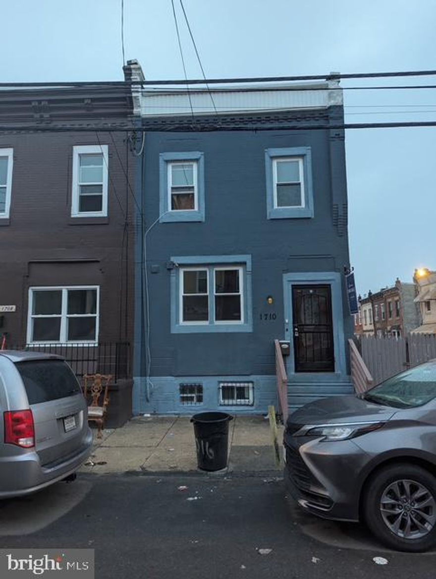 This townhouse at 1710-1712 W. Huntingdon St includes an adjacent empty lot, presenting an incredible investment opportunity near Temple University. The property boasts 4 bedrooms, 4 bathrooms, a den, and an additional room in the basement. The main level includes 2 bedrooms, 2 full baths, laundry, and a side door leading to a small patio. The second floor can serve as an in-law suite with 2 bedrooms, 1 full bath, and an open-concept kitchen/living/dining area with access to balcony. The basement has the potential a bonus room, accessible through the fenced-in lot, offering 1 bedroom, a full bath with a stall shower and living area. The property also includes an empty fenced-in lot and a storage shed, providing even more possibilities for use. Call and schedule a private showing today!