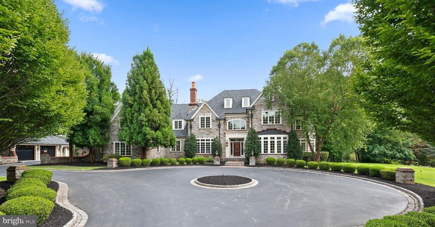 No expense was spared in the complete renovation of this 10,000 sqft custom estate home within the highly desirable White Horse community. Sited on a nearly three-acre double lot, the main house and guest house feature extensive stonework, architectural shingle roofs and a belgian block circular driveway. Inside, a grandly-scaled entry foyer boasts a two story hanging chandelier, and opens to a formal dining room and formal living room with beautifully molded fireplace. An executive-sized office overlooks the substantial rear grounds with french doors to the flagstone patio and is clad in extensive millwork and decorative fireplace. A sunny conservatory with private fireplace offers a quiet respite or a second home office. The heart of this grand home is the stunning kitchen, with custom cabinetry, Thermador commercial grade appliances, quartz counters, and butler’s pantry with a wet bar and wine fridge. An open breakfast room and large family room flank the kitchen, with beamed ceiling and floor to ceiling windows overlooking the rear grounds and patio. A private bonus room adjacent to the butler's pantry makes a great playroom, bar room or craft room. The second floor primary suite has the scale one would expect in a home of this size- a large bedroom with fireplace and french doors to a private balcony, an oversized bathroom with dual vanities, soaking tub and expansive shower, a bright and inviting sitting room, and a large dressing room. Four additional ensuite bedrooms, a central homework lounge, and a spacious laundry room complete floor two. The third floor offers privacy with an additional spacious bedroom and full bathroom with stall shower. The lower level is open, bright and ready for all your entertaining needs. The custom bar and wine room with attached tasting area are waiting to be enjoyed while the gym and spa-like bathroom with steam shower allow you to relax and unwind. There are two more additional finished spaces- one ready to be furnished for your future home theater and the other an optional game/play room. The large rear grounds are quiet and private and feature an outdoor fireplace, stone patios and a pond that can be replaced with a pool, if desired. There is an additional 1200+ sqft guest apartment over a two car garage, bringing the total parking spots to five, an appropriate addition to this grand estate. Walkable to Episcopal Academy with a direct path at the end of the street; minutes to other prestigious private schools such as the Agnes Irwin School, the Haverford School, Malvern Preparatory, and Academy of Notre Dame; a quick drive to downtown Wayne and Paoli train station with direct access to Philadelphia and New York; and close to all major roadways for an easy commute- this house is central and close to everything. Call today for more information; this property is not to be missed!