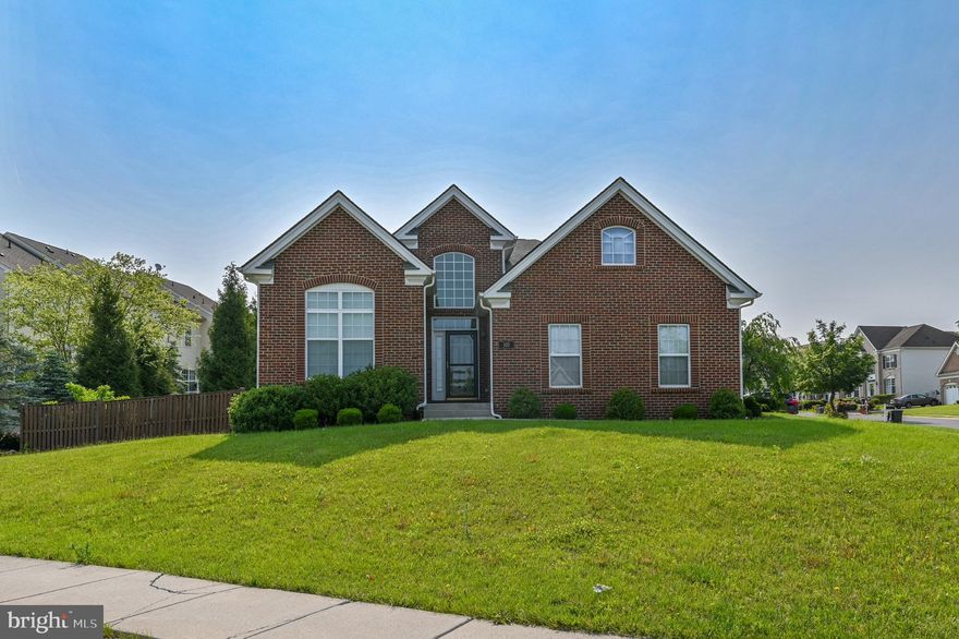 Welcome to Martinsburg Station! This Rancher is waiting for you. What a beautiful, immaculate, and truly rare find. When opening the door to this home, a two-story foyer featuring 10-foot ceilings and vaulted/cathedral ceilings, along with crown moldings, creates a spacious and welcoming atmosphere. The Foyer could be a parlor with seating. The home features all hardwood floors, two spacious bedrooms, and two full bathrooms on the main level. The primary bedroom features a tray ceiling, a walk-in closet, and windows that provide ample natural light.​ The primary bathroom features two separate comfort vanities and an all-tile walk-in shower with its own bench for sitting. A chef's dream is the gourmet kitchen with granite counters, Kitchen-Aid stainless steel appliances, a built-in microwave, disposal, a pantry, and 42” upgraded cabinets—a separate Breakfast Nook with a bay window. The Dining Room and the Living Room could be interchanged and used in any way the owner chose.  The one room has a gas fireplace with a mantle. Glass French doors from the room with the fireplace lead to a Sunroom filled with natural light. The Sunroom leads out to your maintenance-free Trex deck for relaxation. The large laundry/mud room comes with a utility sink. The lower level includes an oversized carpeted Recreation Room and a full bath with ceramic tile flooring. A full eat-in kitchen has been added with all brand-new, never-used stainless steel appliances. An additional room with a walk-in closet​ has recently been completed. This could be a private retreat or office. ​The home has a side-load, insulated, oversized two-car garage. The rear yard is fenced in. This home sits on a corner lot with sidewalks and street lights. Martinsburg Station boasts a spectacular mountain view, complemented by amenities such as a competition-size pool, clubhouse, tennis courts, and walking trails. Tree-lined streets with sidewalks and common areas. This immaculate home is conveniently located near I-81 and the MARC train station, making it ideal for commuters.