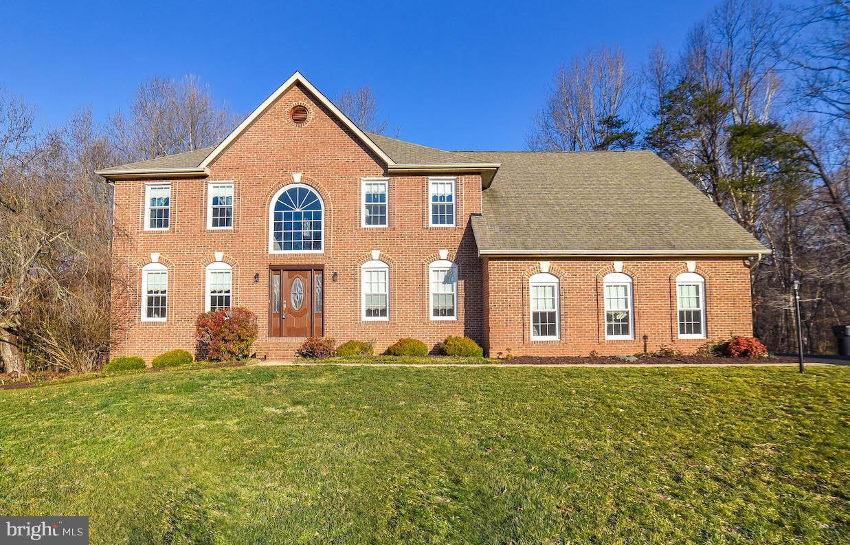BIG BOLD BEAUTY! Fall in love with this spacious 4700 sq ft BRICK Colonial located in sought after La Plata. Walk in the door to this 2 story foyer and make your way to the updated kitchen overlooking the family room w/ vaulted ceiling and gas fireplace. Doors to deck overlooking pastoral setting with level ...usable backyard backing to woods. Upstairs bedrooms are great size! Master bedroom w/ sitting room, two separate closets, balcony overlooking the backyard and luxury master bathroom w/ soaking tub, separate shower and double sinks. Updated walkout basement w/ full kitchen perfect for in law suite or can be used as separate space. 5th bedroom, full bath, and theater room. Wait...yes, a 2 car attached garage and a 2 car detached garage with walk up storage above. Geo-thermal heat/air system!!! Windows updated 2 years ago. First one in the door is a winner!!!!