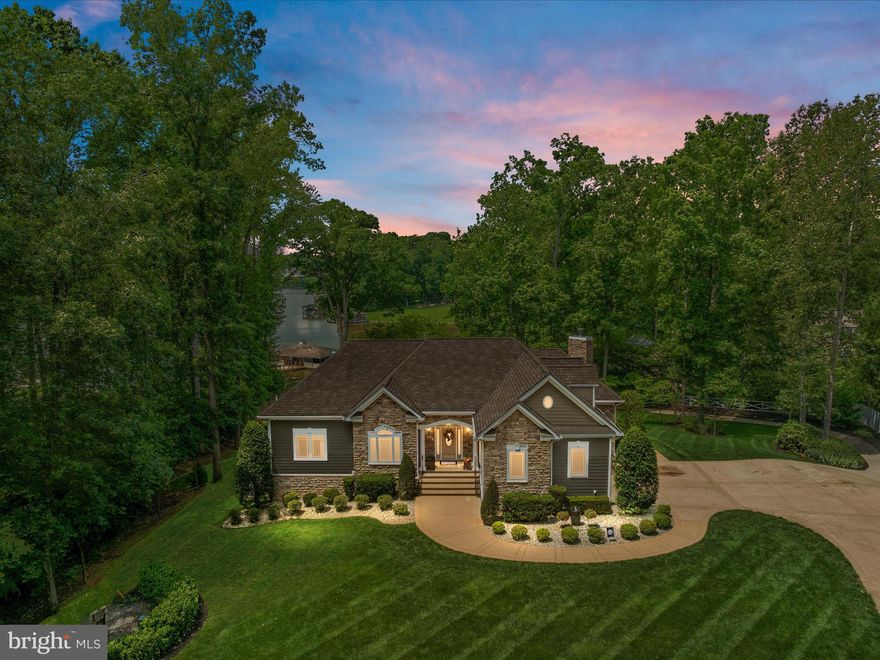 **Back on the Market - The Buyers Financing Fell Through Days Before Closing! At no fault to the Seller, this beautifully maintained home is available for you. All contingencies were successfully met - including home inspection, water quality test, well and septic inspections, appraisal and more. **

Welcome to your DREAM WATERFRONT oasis on the shores of beautiful Lake Anna, Virginia. This exquisite custom built home offers over 5,800 square feet featuring a total of 5 bedrooms, 4.5 bathrooms, 2 car side load garage, detached 3 car front load garage, private pool with slide, hot tub, boat house, dock and peaceful situated on 3.94 acres. Nestled on the tranquil shores of Lake Anna, this property offers unparalleled water views and direct access to the lake. Enjoy boating, fishing, and water sports right from your own backyard. This is a rare opportunity to own a slice of paradise!

You will be impressed by the hand selected custom floor plan with stunning water views. The main level includes stylish hardwood floors, impressive natural lighting throughout and easy access to your oversize deck. The two story great room provides lake views while overlooking the pool, while enjoying a cozy gas fireplace. Enjoy cooking in this gourmet kitchen with high-end stainless-steel appliance package including a gas cooktop, wall oven, custom cherry cabinets, quartz countertops, and breakfast bar seating. The kitchen connects to a separate dining room great for entertaining your family and friends with amazing views of the lake. Relax in the living room by beautiful stacked stone wood burning fireplace with custom mantel. The owner’s suite has been completely remodeled with all of the modern finishes – free standing tub, frameless shower with bench, upgraded light fixtures, modern vanity and dual sinks, gorgeous tile selections, tray ceiling and a spacious customized walk-in closet. The main level features a study/office, large laundry room with plenty of storage space, powder room and secondary bedroom suite with its own completely remodeled full bathroom. The upper level offers a great third bedroom or upper loft area with private staircase for access. The finished lower level offers a huge recreation room with a bar including a kegerator, movie-theater room, family room with cozy gas fireplace, 2 additional bedrooms with full bathroom, storage room and utility room. Walkout to enjoy the pool, slide, and hot tub on the patio. The detached 3 car garage features a separate guest space with a kitchenette, dining area, living room plus a full bathroom. The new Hardiplank siding and Trex deck with mahogany railings is the perfect blend of style and low-maintenance lifestyle at the lake. This home offers high speed internet, security system, whole house generator, and irrigation system. A private boat house and dock awaits your boat, jet skis, kayaks and offers quick access to Lake Anna's 13,000 acres of water. Whether you are seeking a private waterfront retreat or a lucrative income generating rental property, this home offers the best of both worlds. Schedule a viewing today and start living the lakefront lifestyle you have always dreamed of!