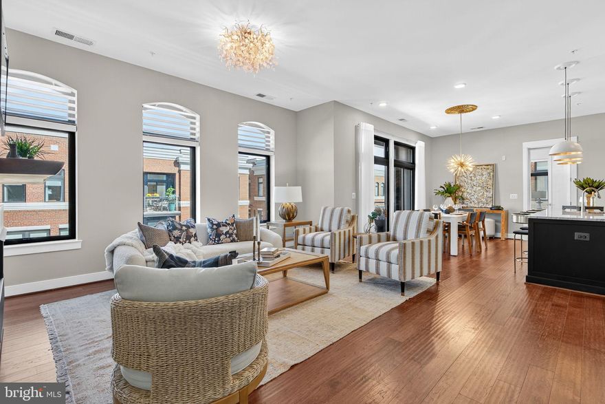 Rare Penthouse Opportunity in the Heart of Historic Downtown Leesburg! Discover the perfect blend of  urban convenience and elevated luxury with this stunning one-level penthouse condo—a truly unique find just steps from vibrant downtown Leesburg.
Soaring 10-foot ceilings and floor-to-ceiling windows fill the space with natural light, creating a bright, airy, and sophisticated ambiance. The open-concept layout features a gourmet kitchen with an oversized island, two spacious bedrooms, two full baths, and a versatile den ideal for a home office or cozy reading or movie nook. Perfecting the floor plan is a lovely balcony with views of the neighborhood and downtown Leesburg.
Every detail has been thoughtfully curated—from custom closet systems in every room and smart remote-control blinds with programmable timers to beautiful light fixtures, wood floors and upgraded finishes throughout.
Enjoy the ease of a private, attached one-car garage plus additional driveway parking. The building is equipped with an elevator for true single-level living.
Step outside and you’re just a short stroll to everything Downtown Leesburg has to offer—boutiques, coffee shops, acclaimed restaurants, luxury hotel, grocery store and more. The building is adjacent to the scenic W&OD Trail, great for biking, jogging or just strolling. Located just minutes to major commuter routes, including the Dulles Greenway. 
This is cosmopolitan living at its finest, perfectly paired with small-town charm. Rarely does a home combine luxury, walkability, and one-level living in such an unbeatable location. Don't miss this amazing opportunity!