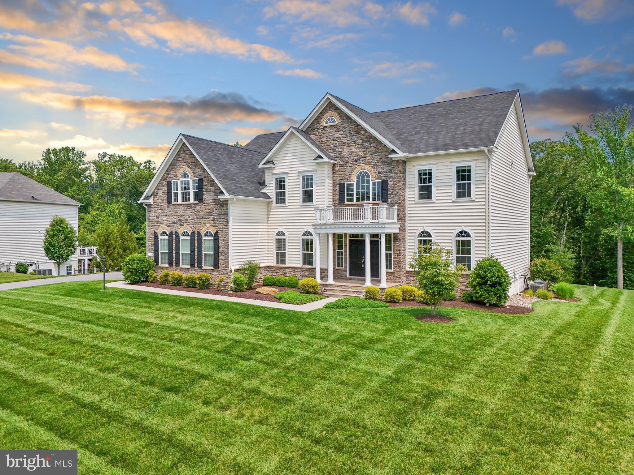 *** Under Contract - Open House Cancelled*** Welcome to the sought-after Morgan Creek neighborhood. You will fall in love at first sight! Arrive to see a gorgeous stone & siding exterior perfectly sited on nearly an acre lot backing to a serene forest conservation area! This home has it all! Upon entry you are greeted by a voluminous 2-story foyer with an inviting curved staircase and formal living & dining rooms. The sizable dining room has a butler’s pantry & wine rack which makes for seamless entertaining. Take note of the gleaming hardwoods throughout the main level updated with 5” planks. The enormous center-island kitchen is a dream! You will appreciate the 5-burner cooktop & 2 dishwashers for those busy nights and entertaining on the weekends! Exceptional cabinet space and a walk-in pantry for ease of storage and access. Plus, a customized and expanded kitchen area with a quick-grab wine & beverage fridge & glass-front cabinets. Mornings can be enjoyed in the sunny breakfast room overlooking the backyard or out on the patio with views of the expansive lawn space and treed backdrop. The kitchen and breakfast areas have built-in speakers and open up to a delightful family room with a cozy gas fireplace overlooking the scenic backyard. Tasteful columns accent this room for an elevated feel. There is also a private main level office, perfect for a work-from-home space. Plus, for quick access to the upper level, a rear staircase is available. Fabulous upstairs layout with 5 bedrooms & 4 full baths plus a convenient laundry room. Plenty of space for a growing family or your favorite house guests! The primary bedroom suite has a tray ceiling, luxurious bathroom, and is fitted with custom his & her closets for the wardrobe enthusiasts! Adjacent to the bedroom sitting area is also a bonus closet with shelving for a versatile storage area or hobby space. Of the 4 additional upper-level bedrooms, 2 rooms are sizable and en-suite with excellent walk-in closet space and the other 2 bedrooms are perfectly situated alongside a large hall bath. This home also has a wonderful lower-level recreation room with ample space for game-nights, movie-nights, or simply to enjoy your favorite cocktail at the fabulous entertainers wet-bar! Built-in speaker system for a surround sound experience. Pool table conveys! With sun-filled double doors leading up to the backyard, you can easily blend with outdoor activities. Don’t miss the full bath on the lower level - there is even space available to complete a 6th bedroom and/or home gym, if desired. Ample storage spaces and/or workshop area as well! Outdoors, your family & guests will truly enjoy the beautifully designed patio all year long with a fantastic natural gas fire-pit and built-in bar area! Additionally, the yard is equipped with an 18-zoned irrigation system to keep your lawn and extensive landscaping beautiful all season long. And with an extended 3-car side load garage, you will have plenty of space to store garden tools, sports gear, and more!