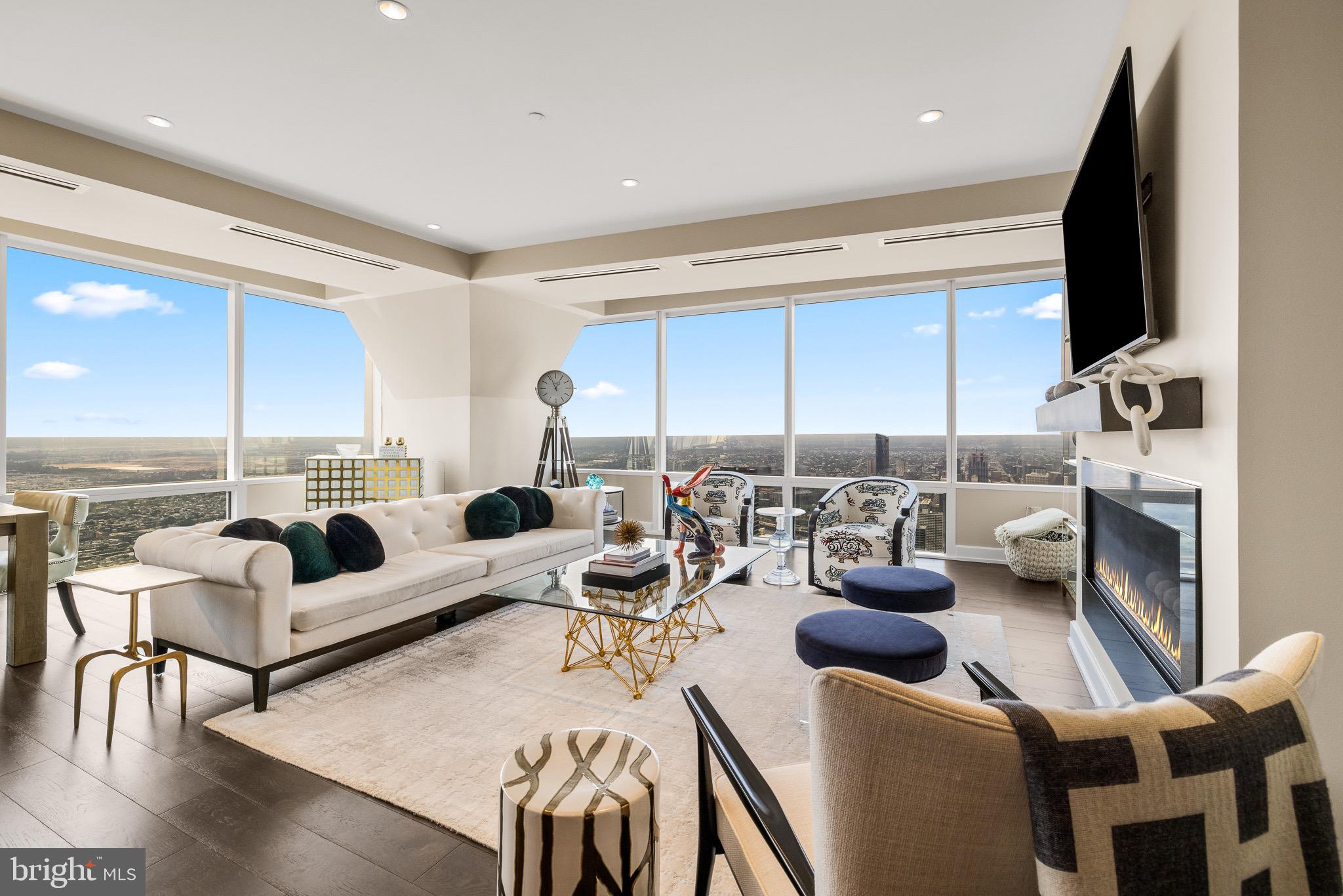 Introducing a rare opportunity to lease an extraordinary condominium at The Residences at Two Liberty, a sanctuary of sophistication, style, and privacy situated on the 55th floor. This exceptional 3-bedroom, 3.5-bath home offers a meticulously designed layout with sweeping water vistas and captivating cityscapes. Two parking spaces are included, and the owners are open to discussing select furnishings for a turnkey move-in. Enter through the custom-designed, spacious foyer into a gourmet kitchen that flows effortlessly into an expansive living and dining area, framed by floor-to-ceiling windows and a contemporary fireplace. Truly an atmosphere equally suited for refined entertaining or quiet enjoyment.
Set in a premier location surrounded by acclaimed dining, upscale boutiques, and cultural landmarks, this residence is moments from the greenery of Rittenhouse Square Park and under 10 minutes from 30th Street Station, ensuring effortless connectivity.
An array of world-class amenities awaits, including a 24-hour fitness center with panoramic skyline views, steam rooms, saunas, yoga studio, endless pool, private massage suites, board room, business center, and a billiards and media lounge. Residents enjoy the convenience of 24-hour concierge service and the luxury of a chauffeur-driven Mercedes town car. Pet-friendly and part of the exclusive Penthouse Collection, this residence exemplifies elevated urban living in Philadelphia.