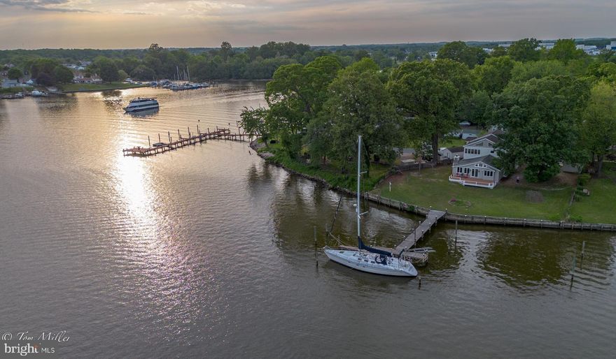 Please DO NOT tresspass or walk around on the property without an appointment!

PICTURES DO NOT DO THIS ONE JUSTICE! Amazing WATERFRONT ! 
Discover the charm of waterfront living in the highly sought-after Wilson Point peninsula! Welcome to 1135 Beech Drive in Middle River, and experience the magical sunsets from your deck, yard,  pier .....Living Room, Parlor .... and Primary Bedroom!  Freshly painted throughout...whole house fan, vaulted ceilings, exposed beams, pocket doors.  This unique property has evolved from its original charm as a summer shore cottage, to a spacious home, thoughtfully expanded over the past 40-50+/- years, featuring vaulted ceilings, windows galore,  two additional bedrooms, a second floor laundry room and 2nd full bath . The latest addition includes a 740 square foot garage with two rooms and a roughed-in (3rd) bath above,   ready for finishing to your specifications. The Exercise Room or 4th Bedroom offers flexible space with a back stair and access to both  outside and the garage. Enjoy 98 feet of prime water frontage with a long pier, providing deep water, perfect  for a sailboat. Don't miss this opportunity to own a piece of paradise! Schedule a showing today and make this waterfront gem yours!