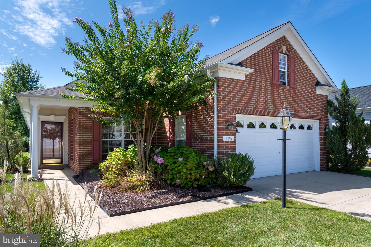 JUST REDUCED... Welcome to 705 Harmony Way in the sought after community of Symphony Village at Centreville. This beautiful 3 bedroom, 2 bath Vivaldi model home is awaiting it's next owner. The brick front of the home is just the beginning to the many upgrades that the current owner has added to the home. As you enter, you'll notice the beautiful hardwood flooring and new carpeting. The open floorplan with a gas fireplace located on the side of the home allows for an abundance of natural lighting to enter the home. The gourmet kitchen features granite counters and upgraded stainless appliances. As you enter the master suite, your eyes will be drawn to the trey ceiling and ceiling fan. This home offers a unique master bath compared to other homes in the community and features a walk-in shower in place of the corner tub with a dual vanity and linen closet. The rear of the home features a screened porch with ceiling fan, sun screens and a paver patio. This home also includes a home generator and portable HVAC unit in the sky basement above the garage.