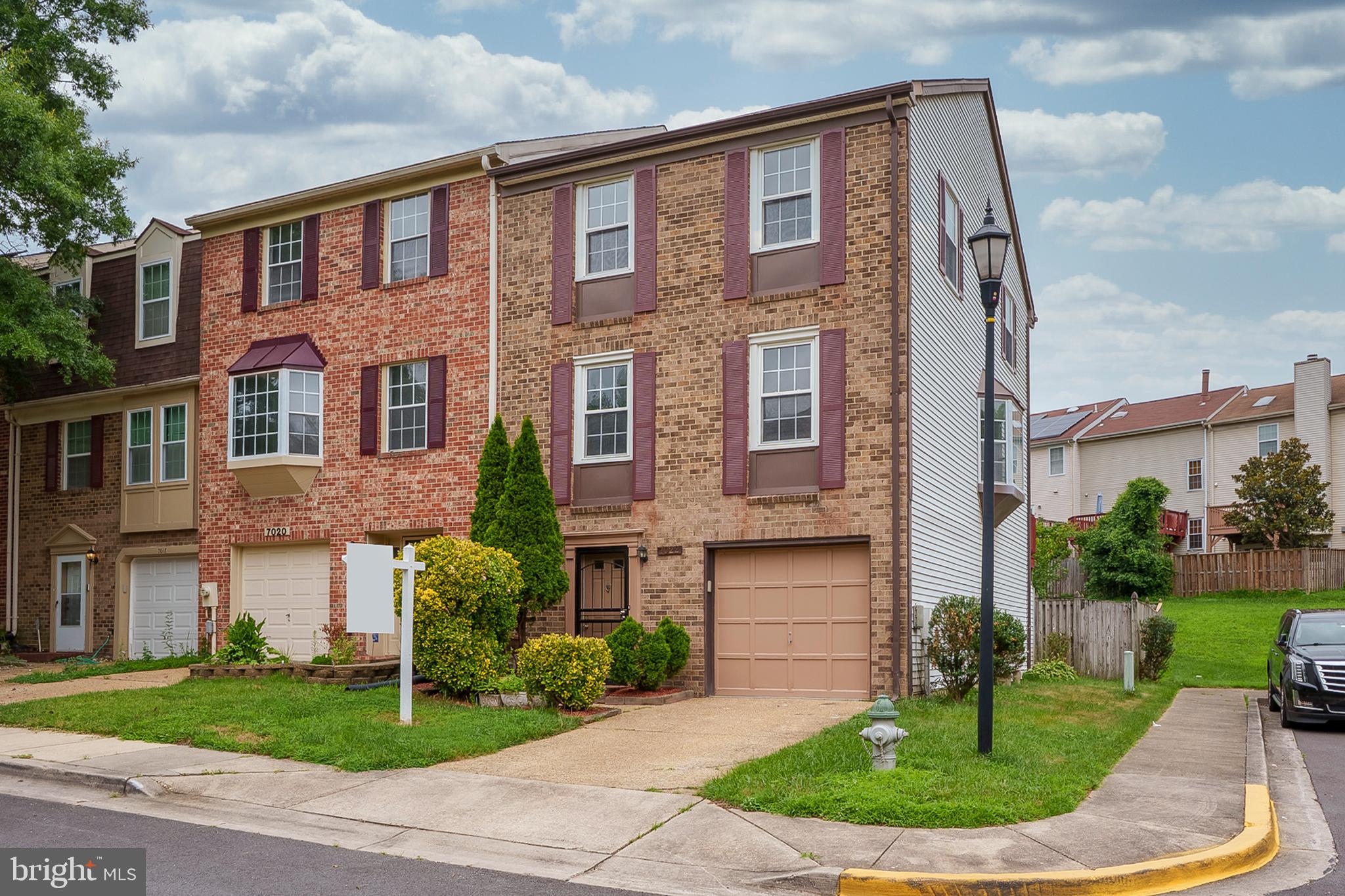 This is the home you've been waiting for, which has everything you want and need! A MUST SEE 3 bedroom, 3.5 bathroom "end-unit" townhome with a 1 car garage! This beauty has gleaming hardwoods in the living room, dining room, kitchen & primary bedroom. Other features include crown molding in the living & dining rooms, renovated bathrooms, stainless steel appliances & granite countertops. The spacious 2nd & 3rd bedrooms have been freshly painted, with new "plush" carpeting installed and, they both have generous sized closets! In addition to the lovely hardwood flooring, the "extra large" primary bedroom has a ceiling fan, a full wall of closets & a skylight! The fully finished basement has a spacious recreation room with a cozy "stone" fireplace, full bathroom & sliders leading to the patio! This home is definitely made for entertaining with its spacious, re-finished deck, concrete patio & fully fenced "private" backyard. Extra windows on the side, including a large bay window in the dining room, let in lots of natural sunlight! Home is being sold strictly "as is" but is in great condition. To see this home is to fall in love with it! Make your appointment to see this one today, as this one will not last!