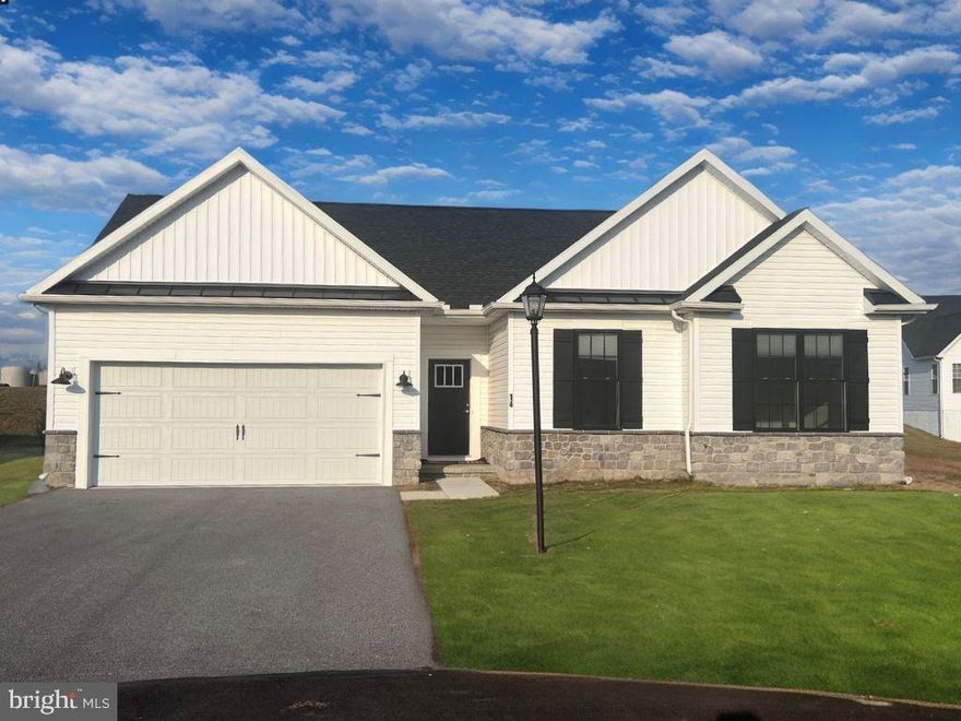 A cozy, sheltered front entry along with Stone to Grade is the first hint that the home within is designed to welcome guest and provide a haven of contentment for its owners. Step into the family room and let your mind’s eye explore the possibilities.  The Vaulted Ceilings and Natural Light is so inviting to the space. The kitchen and breakfast area are cleverly hidden from sight as you enter, but open to the family room and rear yard, thus expanding the space for large gatherings. On the other side of the home, the owner’s spacious suite with Walk In Closet and En Suite is tucked away in the back of the house…perfect placement for lazy morning sleep-ins or as a peaceful refuge any time. 2 additional bedrooms, which share the second bath. A first floor laundry is conveniently located  for housekeeping ease, and is located near the two-car garage with its own outdoor access. Schedule your showing today!