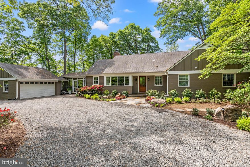 Nestled on a secluded, wooded 1.1-acre parcel in the heart of Alexandria City, this gorgeous family residence offers a singular combination of tranquil countryside vibes with urban convenience. Prepare to be delighted as you enter and explore a dwelling meticulously renovated for both relaxed family life and effortless social gatherings. Nothing was left untouched in the transformation of this spectacular home. Boasting five bedrooms and four and a half baths, main-level primary, storage galore, a walk-out lower level, and all the bells and whistles. Arrive via the wide, circular driveway or the two-car garage and step into the foyer. You will be greeted by a formal sitting room overlooking a generous dining area with a gas fireplace. In the new two-story addition toward the rear, discover the heart of this home - a chef's kitchen with soaring ceilings and ample natural light, flowing into the great room and a sheltered rear deck ideal for morning coffee amidst the treetops. Envision crafting culinary masterpieces on your 48-inch dual-fuel Thermador range, surrounded by your oversized island, marble countertops, coffee bar, and much more. Whether you're hosting intimate gatherings or grand celebrations, this culinary space is crafted to impress. You will love the side entrance and mudroom adjacent to the sizable butler’s pantry and laundry room, making chores simple and convenient and main-level living a breeze. Just off the mudroom is an attractive screened-porch. With its haint blue ceiling and wired for sound just like the great room, this spot is perfect for sipping lemonade and hosting summer brunches!  Rounding out this floor is a luxurious primary retreat. Rarely found in Alexandria, this main-level sanctuary is what dreams are made of! From the custom office nook to the closets to the porch to the bath - every element was deliberately conceived to make this space both functional and a true haven for unwinding. The en-suite bath showcases two marble-topped vanities, elegant sconces, Carrara tile, a separate water closet, and a "wet room" with a stand-alone soaking tub and multi-head shower. Indulge in heated floors throughout and a heated towel rack to melt away the day’s stresses. Upstairs, two airy bedrooms share a completely renovated bathroom with a double vanity. The bedrooms each offer extra storage or play rooms - wonderful for a hideaway or snuggling up on the window seats with a good book. Step downstairs to find an incredible walk-out lower level, extending the possibilities for comfortable living and entertaining. This versatile space features a spacious bedroom, a full bathroom, and a dedicated storage or fitness room to meet your needs. Picture evenings spent in the inviting recreation room, gathered around the wood-burning fireplace, perhaps with a drink prepared at the wet bar. A built-in desk area offers an ideal spot for work or study. The nearby separate kitchen makes it the perfect venue for movie night or to watch the big game! Adding even more value and versatility is a new addition with its own entrance. This thoughtfully designed area functions beautifully as an in-law/au pair suite, offering a private living area, a full bathroom, and bedroom. The walk-out access seamlessly connects to the serene outdoor area, making it idyllic for indoor-outdoor living and providing a sense of escape. The back features a tree-house playground with slides and swings, a sweeping stone terrace, and the potential for an outdoor kitchen or pool. Conveniently situated, this exceptional property offers the ultimate refuge - without sacrificing easy access to all necessities. You are close to I-395, Del Ray, Old Town and Reagan National Airport. With all new systems, windows, plumbing, electric and so much more - see documents for the complete list - you can settle in with peace of mind. Welcome home!