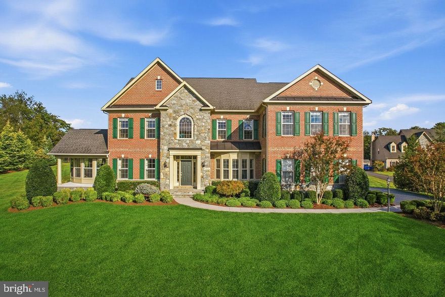 Look No Further. Hamilton’s Harmony Vista is premiering as one of the region's most exclusive luxury communities. This quiet, private enclave features just 27 estate homes, each situated on expansive lots designed to maximize privacy and prestige.

Beside experience luxury living in this stunning Craftmark home community, you are touring the most special home within the community. It was the builder model home features approximately 1.37-acre landscaped lot, stone- brick exterior, over 7,300 sf living space, 4 bedrooms, 5.5 baths, 4 fireplaces, 3 car garages, and the highest, most expensive upgrade options that the architect and builder designed. No detail has been overlooked.  More importantly, this home was build and tested with HERS-rated home' energy performance. It scores at 49 which is 46% more energy efficient than a standard new home.

Step into architectural excellence in this Craftmark masterpiece, where a grand two-story foyer showcases upgraded hardwood flooring, elegant millwork, and custom wainscoting that flows through the dining room and up the staircase. The main level is a study in sophistication, featuring a private library with French doors and bespoke built-ins, alongside a sunroom, powered two side of window wall, conservatory anchored by a see-through gas fireplace. The chef’s culinary center is a showpiece of form and function, featuring commercial-grade Thermador and Bosch appliances, a 6-burner gas range, 42” cabinetry with glass displays, and an oversized granite island. Retreat to the family room, where 10-foot ceilings and a thin-stone veneer fireplace create a majestic yet cozy atmosphere, supplemented by a convenient rear staircase. The open space will lead your sight to the airy large covered porch featuring stone gas fireplace —perfect for a large family and friends gathering and enjoy the outdoor entertaining and relaxing while taking in the tranquil surroundings.

Going to the upstairs, the Primary Suite serves as a world-class sanctuary, boasting oversized tray and vaulted ceilings, a private sitting room, and a three-sided gas fireplace that warms both the master bedroom and the spa-inspired owner’s bath. Two large size walking closets serve her needs. You will have all space you want to store your shoe/bag collection. More than just a sanctuary for rest, this Primary Suite is a masterclass in design, curated to elevate your daily vision of luxury. This upper level is thoughtfully designed for family harmony, featuring other three additional generous bedroom suites—each uniquely equipped with its own private, full en-suite bath. This ensures every member of the household enjoys their own secluded sanctuary, eliminating morning rushes and providing the ultimate luxury of personal space and independence. A masterclass in millwork, crown molding spans the entire floor plan, providing a polished, high-end finish to every bedrooms.

The professionally finished walk-out basement—featuring 9-foot ceilings—is an entertainer’s dream with a home theater with surrounding sound system, stone-accented wet bar, and two versatile bonus rooms can be used as an office, excise room, or even an additional gust room.  The full bathroom is easy access from the two rooms.  Built with high-efficiency dual-zone HVAC and a Rinnai tankless water heater, this residence offers an unparalleled blend of country tranquility and modern luxury within the top-rated Loudoun County school district.