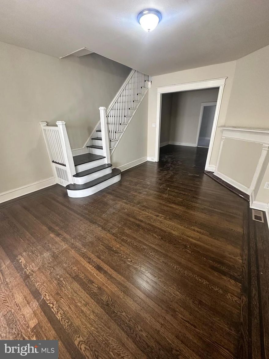 Renovated property with 3 bedrooms and 1 bathroom. Refinished hardwood flooring throughout, new kitchen, central heating system, and laundry hook ups conveniently located on the 1st floor. Private parking space available in the alleyway and an attached garage that could be used for parking or as additional storage.