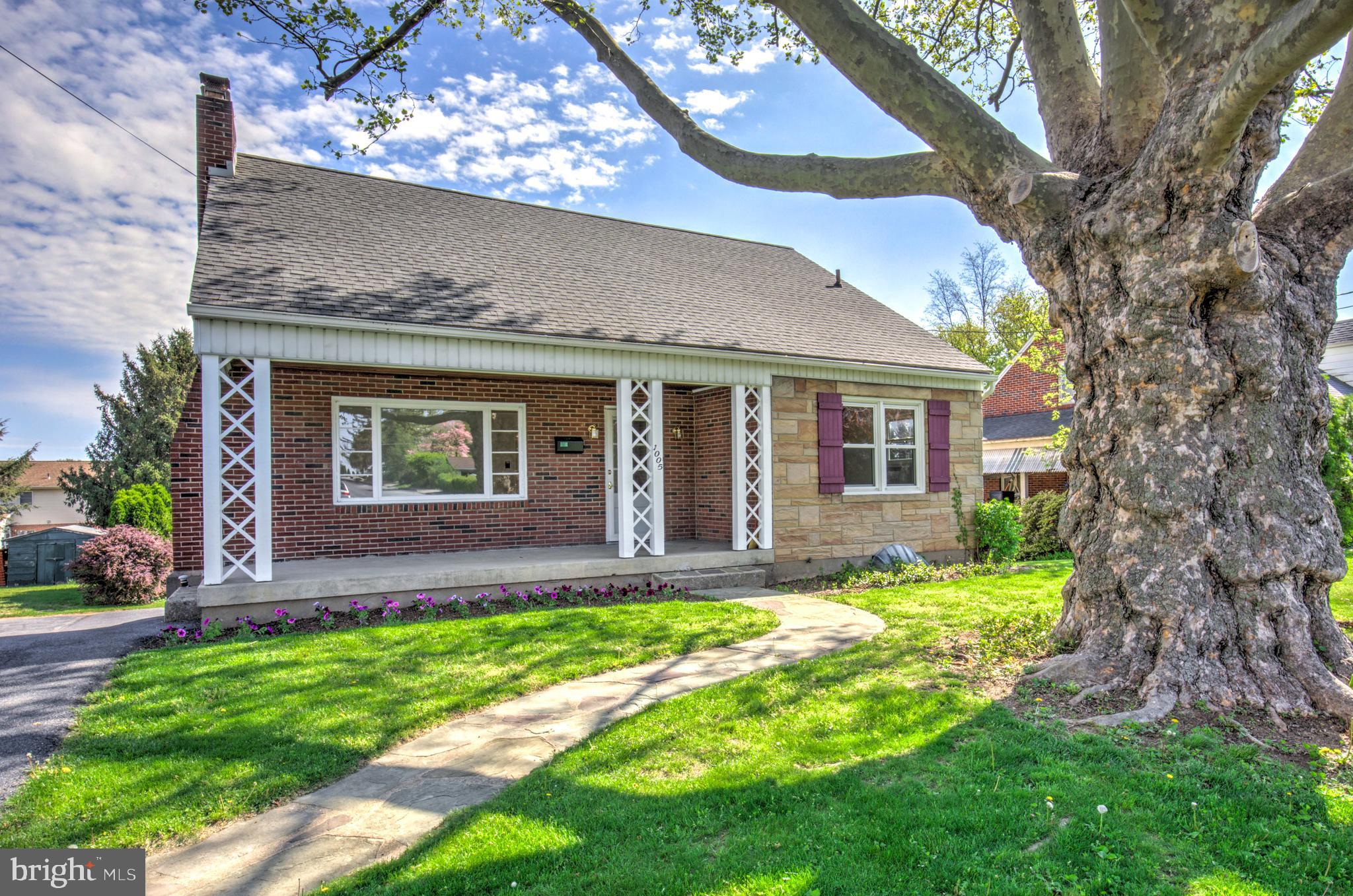 This one packs a punch! You will be pleasantly surprised at the spacious interior of this adorable cape-style home in a fantastic location close to all the amenities you want or need. The whimsical stone walkway leads to a welcoming front porch before you enter into the home. Once inside, you feel the charm and appeal of the wood floors which lead you through the living room where you won't want to overlook the fireplace and replacement windows. The generous sized first floor bedroom also has those amazing floors! On this floor, you also find a large closet and a modern, full bathroom which also houses your washer and dryer. The updated kitchen rounds out the first floor where you will find an abundance of cabinets, some newer appliances, a fantastic island and an eat-in area. If you even want to leave this floor and continue exploring, head upstairs and be prepared to be impressed by the expansive second bedroom with more wood floors and lots of storage space. The third bedroom is across the hall and the second full bathroom is just around the corner. No going downstairs for a bathroom as is sometimes the case in an older home! Overall, the main living areas in this home are surprisingly spacious but it doesn't end here. Heading to the basement, you are greeted by a finished area with more storage space and wonderful windows with a pleasant view of your rear patio and back yard. The other side of the basement is an integral garage which could be converted to additional finished living space since outside you will find a detached garage large enough to park most vehicles and still have room for hobbies, toys and all that good stuff. This one has a lot to offer! Much larger than it appears at first glance so make sure you take a look inside. This lovely home has "raised it's family" and is now ready for a new one. Might it be yours?