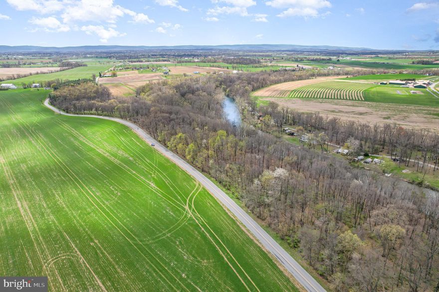 Scenic and secluded 20-acre wooded lot in West Pennsboro Township—zoned agricultural and enrolled in Clean & Green. Enjoy approximately 200 feet of frontage along the Conodoguinet Creek, stunning views of North Mountain, and a peaceful natural setting. Recently surveyed with clearly marked boundaries. Whether you're dreaming of a rustic cabin retreat or recreational use, this property offers a rare blend of beauty, privacy, and potential.