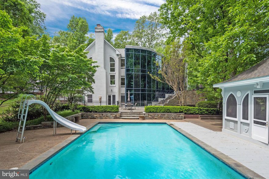 Stunning Great Falls residence with contemporary flair. Exceptionally  designed home suitable for grand entertaining. Boasts an unbelievable $2M+ addition with 3 levels of breathtaking glass overlooking an expansive & picturesque backyard complete with pool, pool house terrace & patio. Gourmet kitchen, luxurious master suite, 3,000 bottle wine cellar, home theater, game room & wet bar.