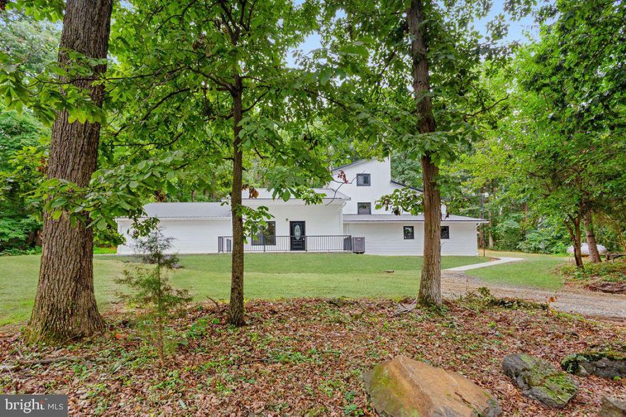 Magnificent remodeled home sitting on 17.63 acres in clean & green, where you can hunt and hike right in your own back yard.  This unique home has multiple entrances making it in law possible and giving you 4,000+ square feet of living space.   Brand new LTV flooring throughout with 2 story foyers, overlooking the family rooms.  Big eat-in kitchen with brand new stainless steel appliances with enormous dining area.   Each level has living room/family rooms.  Main level has 1 bedroom and and a half bath.  Upstairs there is a loft area that could easily be used as a game room, office, what whatever you want it to be.  There are 2 bedrooms and 1 Jack and Jill style full bath, plus washer/dryer hook up area.  The lower level has 2 bedrooms and a full bath, washer & dryer hook ups, mud room and and office or den.  2 Brand new central air units for worry free summers.  So many possibilities with this home comes and make your dreams come true.