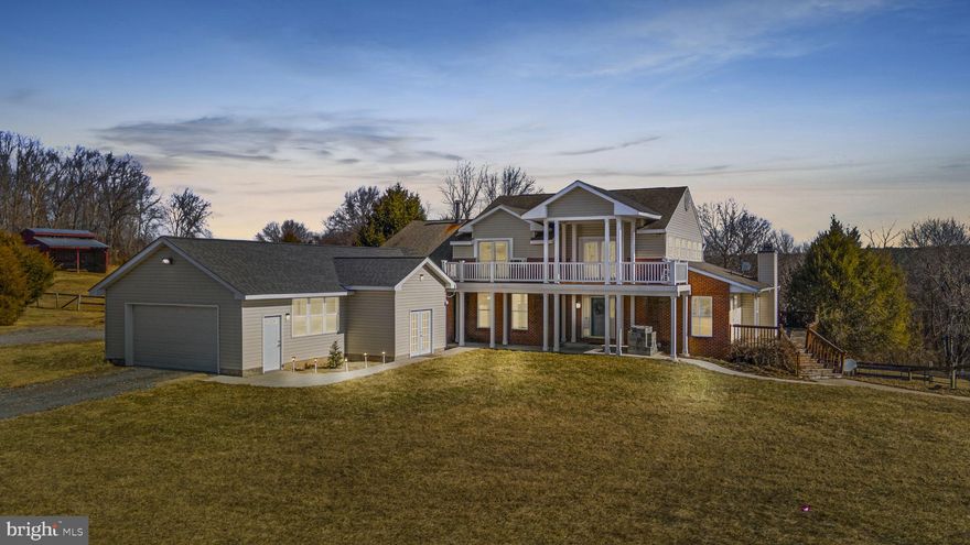 Welcome to 2242 Bollinger Mill Rd, Finksburg, MD—a breathtaking 67.92-acre equestrian estate and active horse boarding facility nestled at the end of a private, tree-lined driveway and backing up to the Liberty Watershed. This exceptional property offers a contemporary main house, two large barns, a riding arena, a boarders’ lounge, a tack room, and 25 acres of serene woodlands—an ideal retreat for horse lovers and outdoor enthusiasts alike. This meticulously designed farm features 10-stall stables with a center aisle, a heated tack room, hot/cold water, a half bath, a utility sink, and a washer hookup. Boarder amenities include individual lockers, a comfortable lounge, and two toilet rooms. Indoor round arena, outdoor riding spaces, and 7 fenced fields. 4 automatic waterers, multiple wash stalls (inside and out), hay and equipment storage, and a tenant garage. Ride directly from your private stables into the picturesque Liberty Watershed.

Main House
This impressive contemporary home boasts an open floor plan with stunning views of abundant wildlife from the wraparound deck. Step into luxury with this stunning home, featuring a grand two-story foyer with elegant ceramic tile. The gourmet eat-in kitchen is a chef’s dream, equipped with stainless steel appliances, custom countertops, a stylish backsplash, recessed lighting, a built-in wine rack, and ample cabinetry. Designed for effortless entertaining, the dining flows into the family room, which showcases soaring ceilings, a cozy fireplace, and oversized windows that flood the space with natural light and seamlessly flow onto the expansive deck, screened-in porch, and patio with a fire pit—perfect for gatherings. Retreat to the private in-law suite, complete with a spacious bedroom, a second kitchen, a full bath, a walk-in closet, and direct garage access. For those working from home, the sophisticated home office features elegant tray ceilings, creating a refined and productive workspace that could also be used as an additional bedroom. Upstairs, you'll find a spacious open family/gathering room, along with two large bedrooms and a full bath, providing ample space for relaxation. The lower level is a retreat of its own, featuring a living room with gleaming hardwood floors and walkout access to the yard, a full kitchen, a large bedroom with a walk-in closet, and a full bathroom—ideal for guests or multi-generational living. Three total attached garage spaces. This home is a rare find, combining elegance, functionality, and comfort. 

Equestrian Business Opportunity
The farm has 25 active boarders who would love to continue boarding their horses at the property but the sale of the property is not contingent on that option.  The opportunity to offer riding lessons, horse training, boarding facility, broodmare operations, farrier, or many other services sought by people in the equine and farming industry.  (More details provided upon request)

Outdoor Paradise
With 40 acres of fenced pasture with a stream, 25 acres of woodlands, and expansive parkland and woods, this estate is a dream for nature lovers. Enjoy riding, hiking, hunting, fishing, kayaking, and more—all from your own backyard.

Don’t miss this rare opportunity to own a one-of-a-kind equestrian sanctuary in a stunning natural setting!