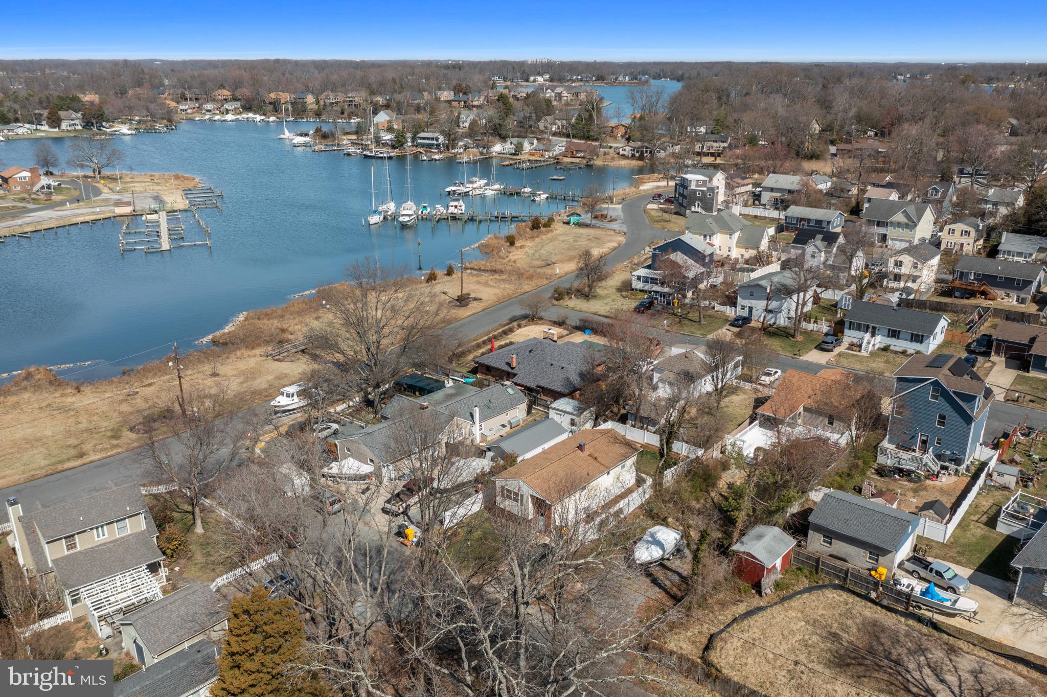 Here is your opportunity to build your perfect home! Outstanding lot with water view in amenity rich, water privileged Woodland Beach. Fantastic buildable lot just two houses from the water. Lot is cleared and ready to build. New home should have a nice water views and great sunsets! Woodland Beach has 3 miles of shoreline bounding Almshouse Creek and Glebe Bay with five sandy beaches each with swimming platforms, crabbing and fishing piers, boat and kayak/SUP launches, parks and playgrounds, a Community Center, private security and low cost boat pier and kayak rack rentals . Blue ribbon award winning schools, walk to shopping, dining, and schools. Quick access to downtown Annapolis and close to commuter routes to DC and Baltimore! An ideal location for year round living or a vacation home without going over the Bay Bridge!