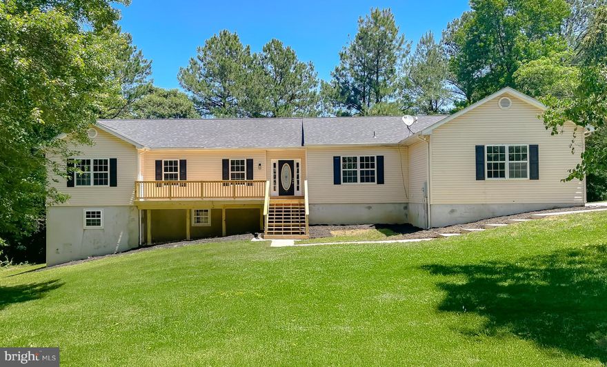 Welcome to this beautifully renovated home on over 3 Acres!  This home features 4 bedrooms and 2.5 bathrooms.  As you enter, you will love the open concept feel with the kitchen open to 2 different living rooms.  The kitchen features brand new white cabinets, an island, stainless steel appliances, and quartz countertops.   Off of the kitchen, there is a spacious living room with a fireplace and a second living room that can be used as an office, dining room, flex room, and more!  Enjoy the beautiful outdoors on the brand new deck off of the kitchen.  As you head down the hall, you will find a large primary bedroom and a large primary bathroom featuring a double vanity, soaking tub, and tiled shower.  This floor also features 3 additional spacious bedrooms and a bathroom with a tiled bathtub.  There is also a laundry room and half bathroom on this floor.  As you head downstairs to the unfinished basement, the possibilities are endless in this big open space.  The walk out basement opens up to a spacious backyard filled with trees and privacy.  Enjoy your coffee on the beautiful front porch.  This home features a 2 car garage, an oversized shed, and 9 foot ceilings.  This home is close to many restaurants, shopping, and is a short commute to Joint Base Andrews, NAS Pax River, Annapolis, and Washington D.C.