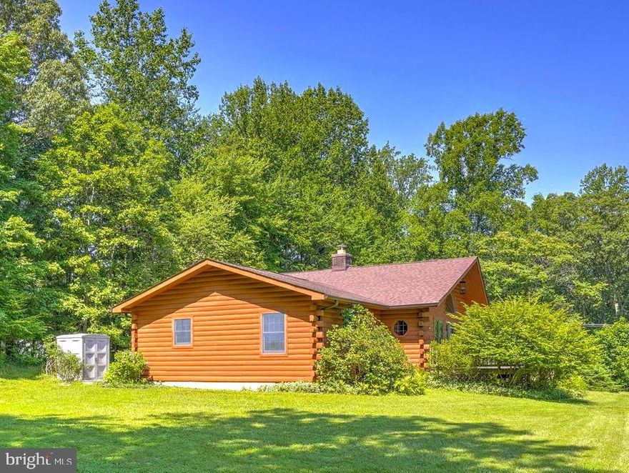 BEAUTIFUL LOG HOME ☆ Great New Price☆ *RAMBLER WITH UNFINISHED BASEMENT * Located in the Heart of Huntingtown!!!  Situated on a beautiful level lot and the lot lines have been recently staked out * This Beautiful Home has a lot of Windows to make it very light, open, and airy!!!  This Home Features:  A Spacious Living Room with Gorgeous Stone Fireplace with Wood Stove Insert, Vaulted Ceiling, Paladium Window , Hardwood Flooring, French Door to Front Yard Deck * The Kitchen has nice Oak Cabinets with All New Stainless Steel Appliances, the Oven has an Air Fryer, Refrigerator with Water & Icemaker, Breakfast Bar & Recessed Lighting * The Dining Area has Hardwood Flooring, Tiffany Lamp, French Door to Back Yard Deck * The Master Bedroom is spacious and has Carpet, 2 closets plus a Master Bathroom with a Jacuzzi/Soaking Tub * 2nd and 3rd Bedrooms have Carpet * Hall Bathroom with Tub/Shower & Linen Closet * There is also an Office/Den with Washer/Dryer closet plus Wash Tub * There is a Partial Basement which is Unfinished/space for more rooms, Free Standing April Air Dehumidifier, New Sump Pump, has 2 Crawl Space Access Areas which have recently been Fully Encapsulated and also new Insulation installed * The home has beautiful Solid Wood Interior Doors, has been Freshly Painted, Heat Pump 2018, Roof 2018 with 10 year warranty for leaks, new Ceiling Fan in Living Room and the Light on the Front Porch, Gutters 2023, Hot Water Heater 2023, Septic was pumped last year and inspected by Jimmy's Septic * Radon Tested year ago and passed * This beautiful home has been very well maintained!!!