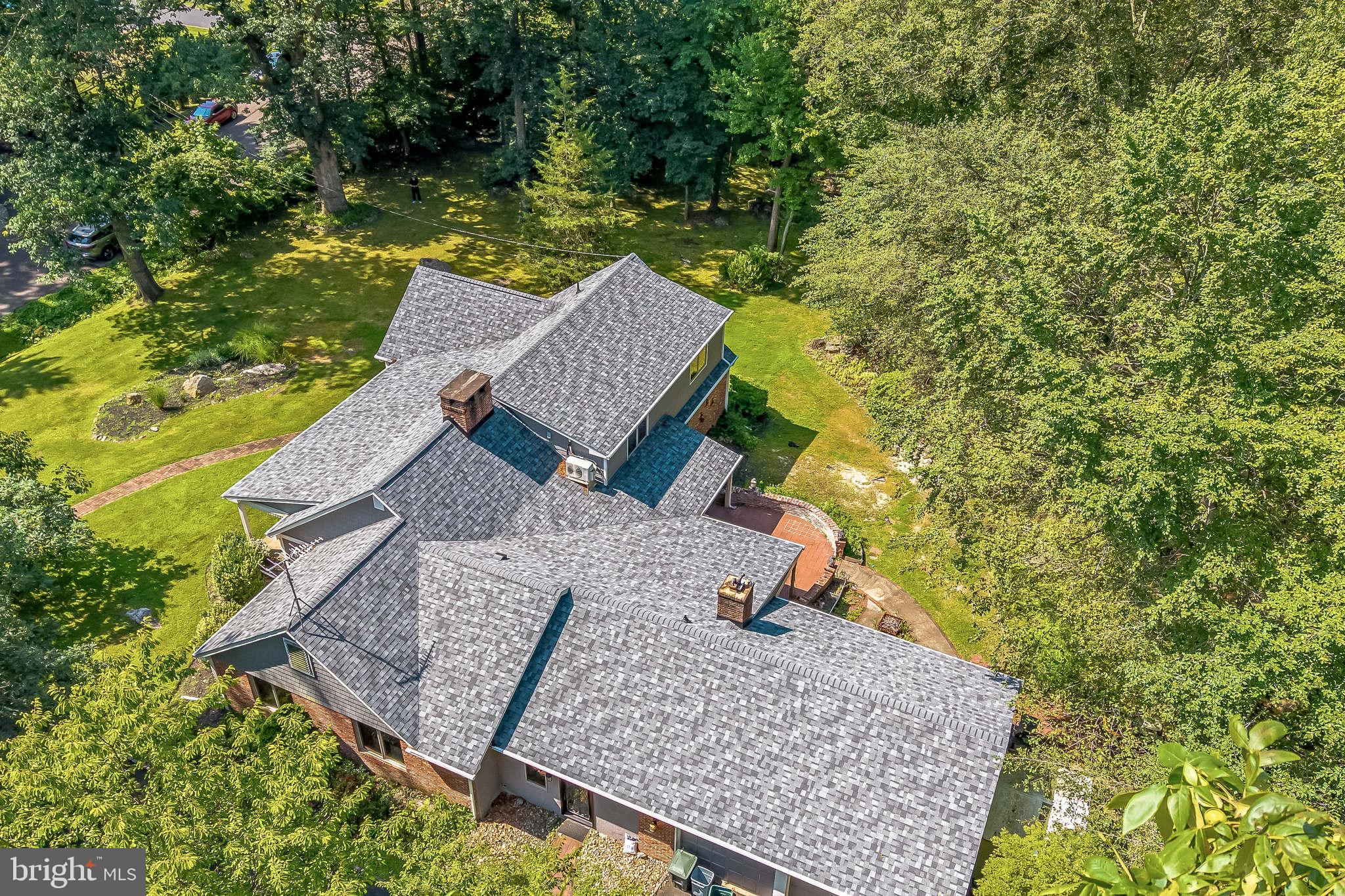 Rare Find - Custom Brick Cape Cod in a Picturesque Park-Like Setting on a Total of Almost 2 Acres of Land (with 2 additional parcels included in sale). Enjoy the Nature in this Tranquil Settings with 2 Bridges & a Stream (and even a Fish Pond). The Spacious Home also Features: Random Width Pegged Hardwood Flooring (have just been professionally refinished), 2 Fireplaces, Huge Walk-Up Attic, Center Hall Entrance, Elegant Living Room w/ Fireplace & 9-foot Ceilings; Great Oversized Eat-In Kitchen that Boasts Wood Beamed Ceiling, Brick Curved Arch Over The Cooktop, Granite Countertops and Updated Stainless Steel Appliances; Spacious Family Room w/ Built-in Bookcases, Oversized Fireplace, & Doors to a Covered Patio. Unusually Spacious & Elegant Dining Room; Renovated Bathrooms; Top-of-the-Line Energy-Efficient Anderson Doors & Windows; New Roof, Gutters, Siding; Upgraded Energy-Efficient Multi-Zone Heating (Gas) and A/C Systems. Attached Oversized Heated 2-car Garage. Strategic Central Location (Convenient to Major Roads, Shopping, Dining, Center City Philadelphia, Train Stations) and Award Winning Sought-After Lower Moreland School District!