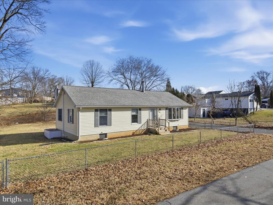 Looking for a 3-bed rancher in Ranson with walkability and outdoor space? This well-kept home sits on three cleared, fully fenced city lots totaling 0.34 acres, just blocks from Main Street in Ranson and the WVU Medical Center.

Built in 1993, this 1,300 square foot ranch-style home features a bright living room with bay window and fireplace, a spacious eat-in kitchen, and a dining area that opens to a large rear deck. The primary bedroom includes a private en suite bath. Two additional bedrooms share a full hall bathroom. A full, unfinished basement offers excellent storage and room to expand or customize.

The backyard is level, fully fenced, and ready for pets, gardening, or recreation. A storage shed adds even more function and a large paved driveway provides ample off-street parking.

Located in the heart of Ranson, you're a short walk to local restaurants, parks, medical services, and more. Easy commuter access to Routes 9 and 340 connects you quickly to Charles Town, Harpers Ferry, Martinsburg, Maryland and Northern Virginia.